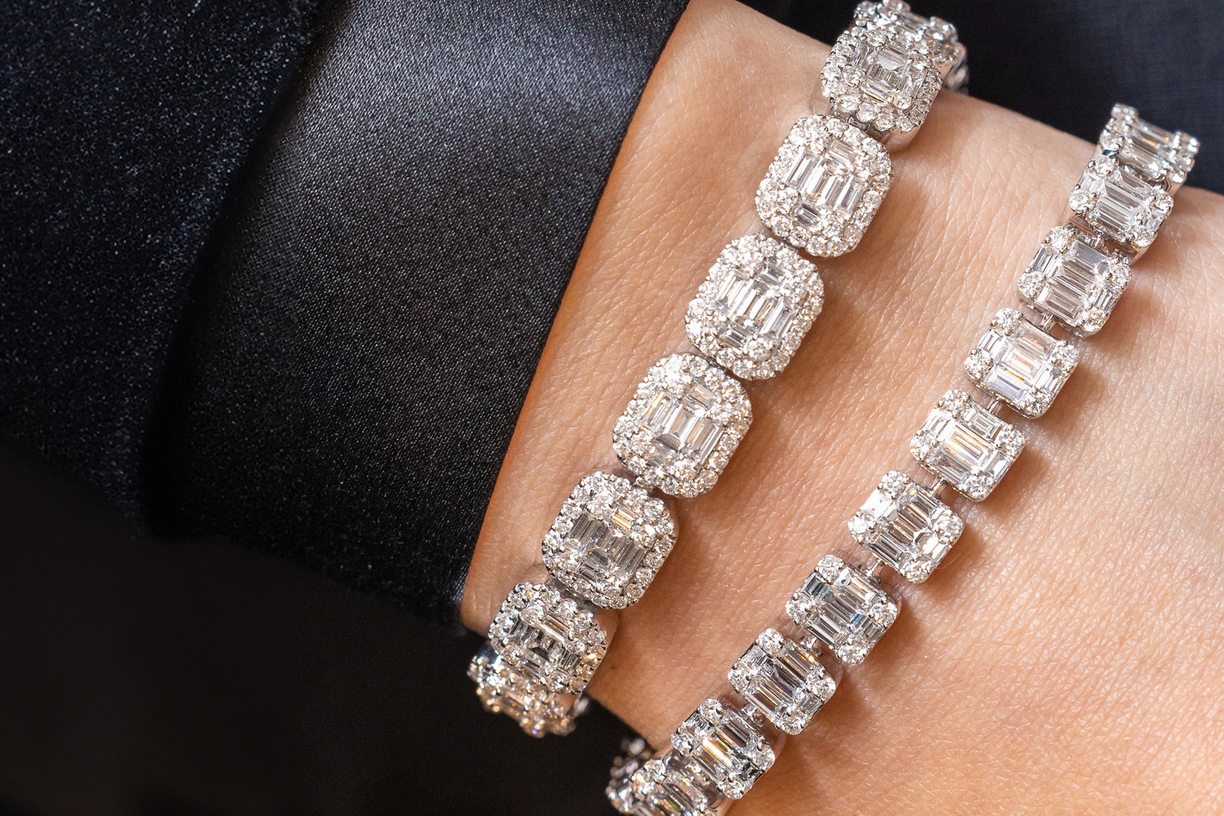Two lab grown diamond tennis bracelets worn on the wrist, IGI certified fine jewelry, Draco Diamond