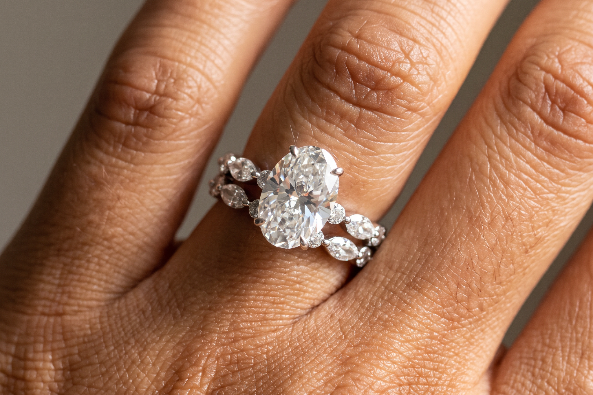 Oval lab grown diamond 3 carat wedding set with matching accent band worn on the hand, Draco Diamond