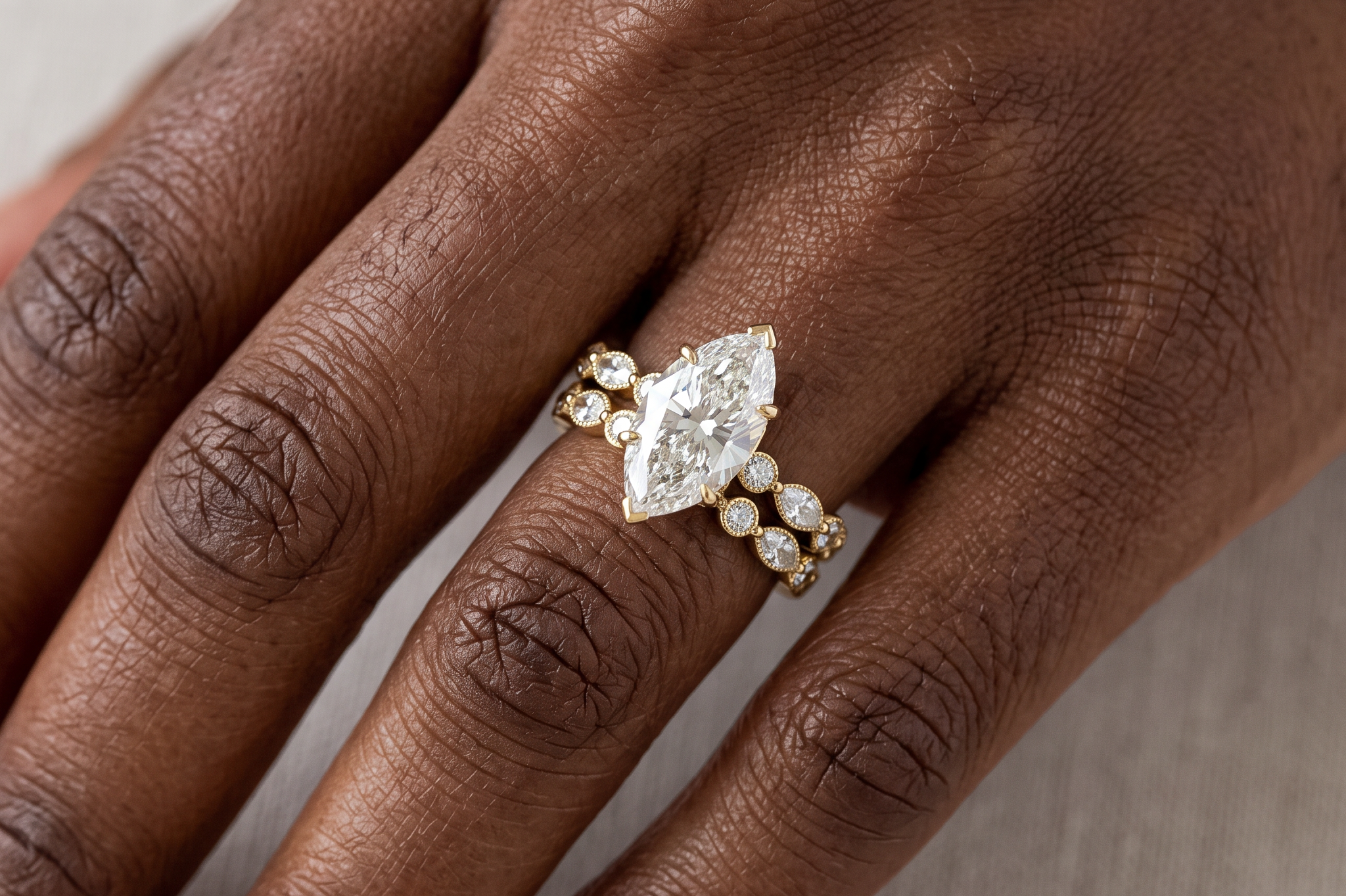 Marquise cut lab grown diamond bridal set worn on the hand, engagement ring and matching band, Draco Diamond