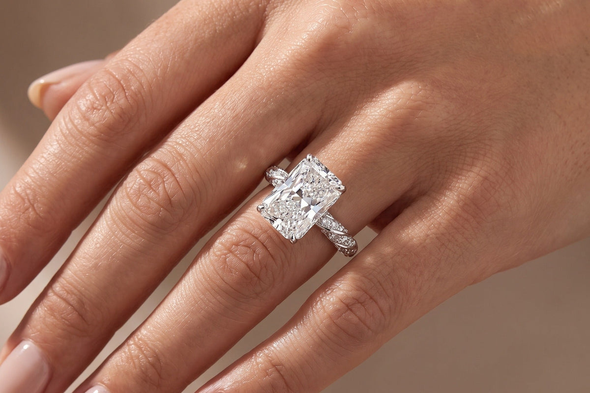 Radiant cut lab grown diamond ring worn on a hand in soft daylight, showing face up size against the finger, diamond size chart, Draco Diamond