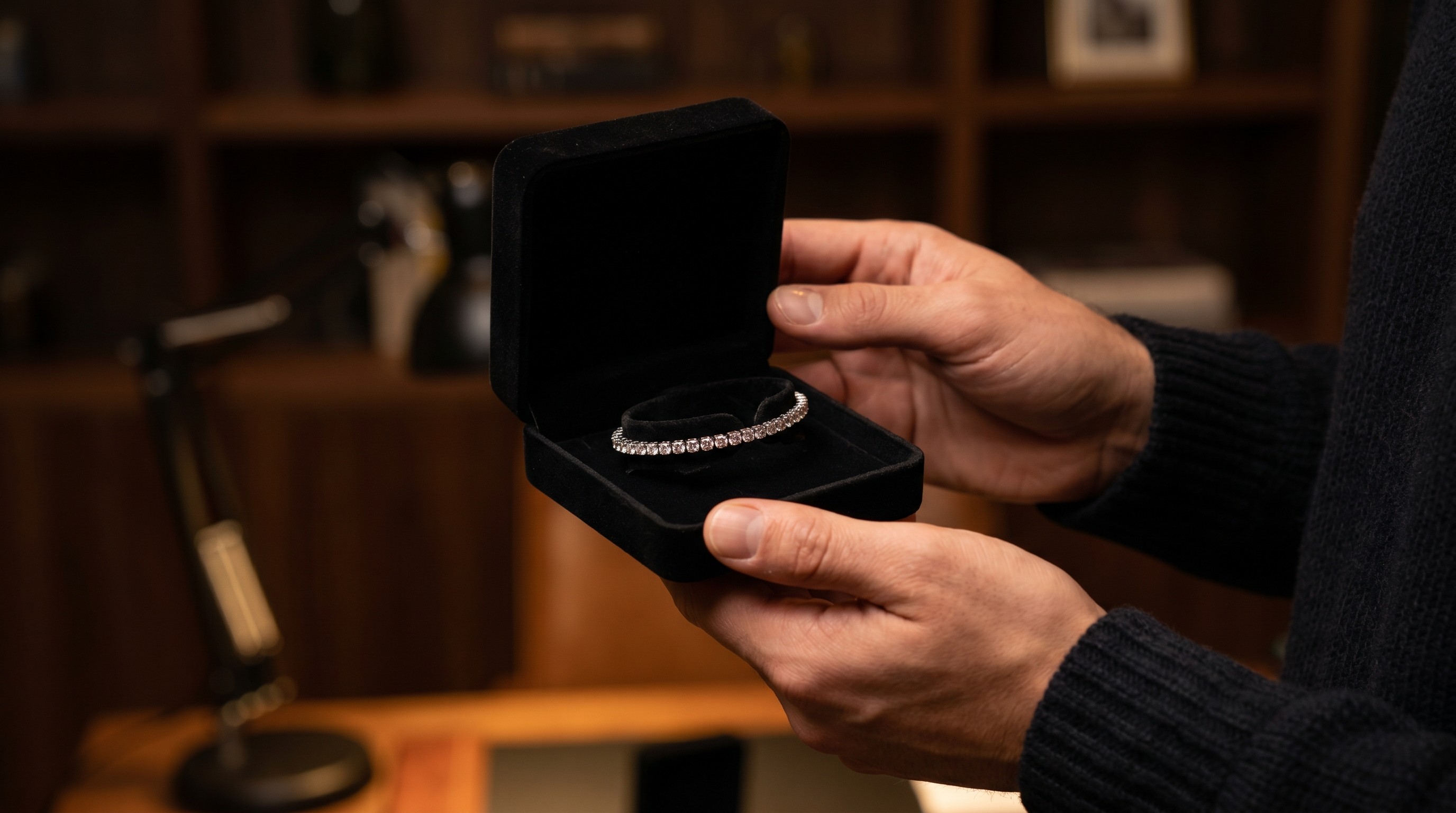 Hands presenting an open jewellery box during a founder reviewed custom diamond quote at Draco Diamond in Canada