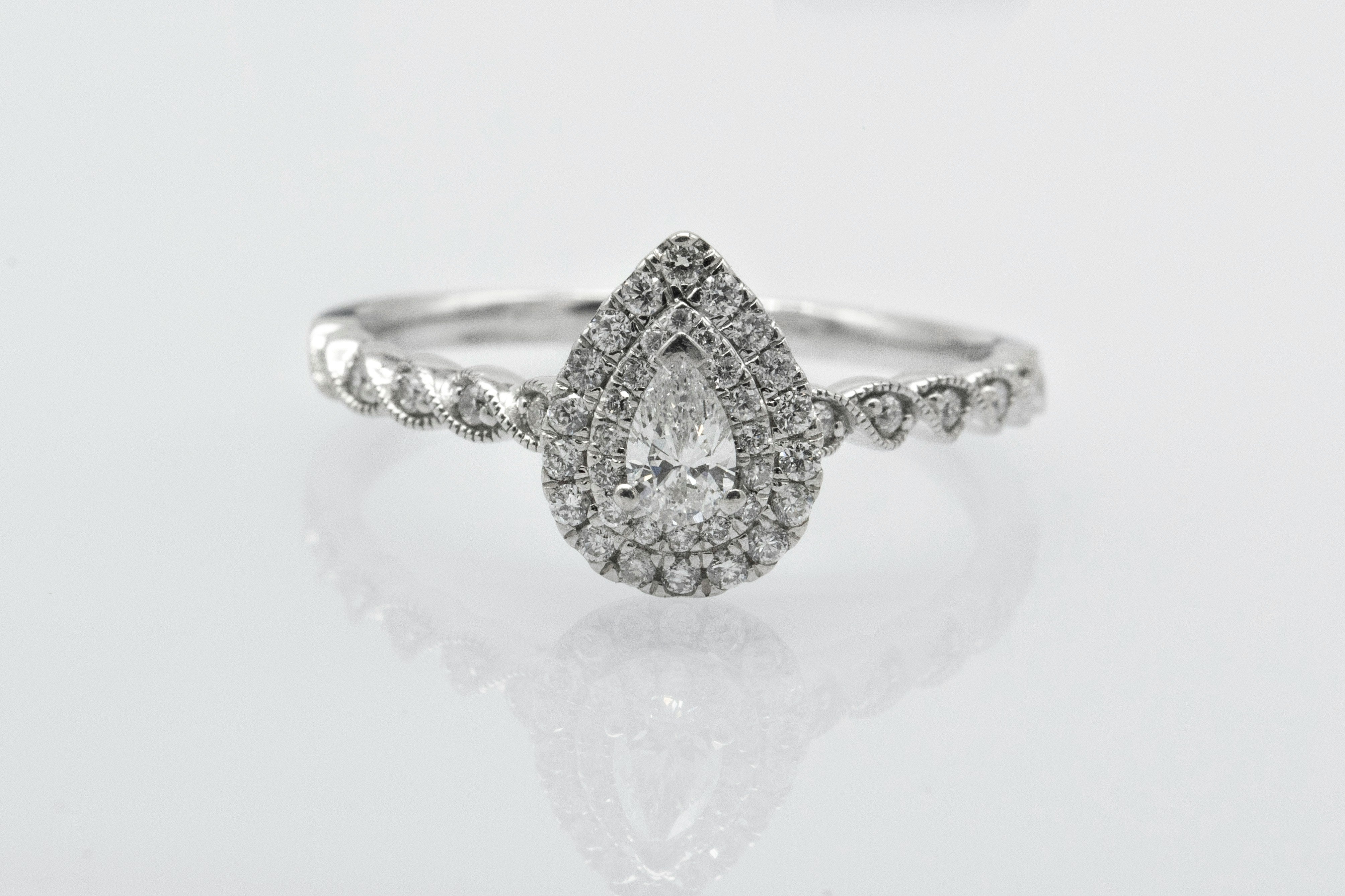 Pear cut lab grown diamond engagement ring with a double halo of melee stones, Draco Diamond Canada