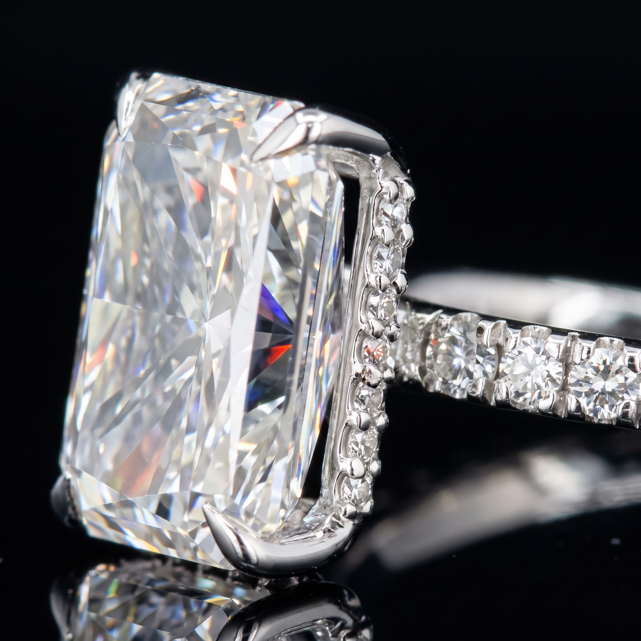 hidden halo pave collar beneath 5ct radiant lab diamond center stone, extreme macro