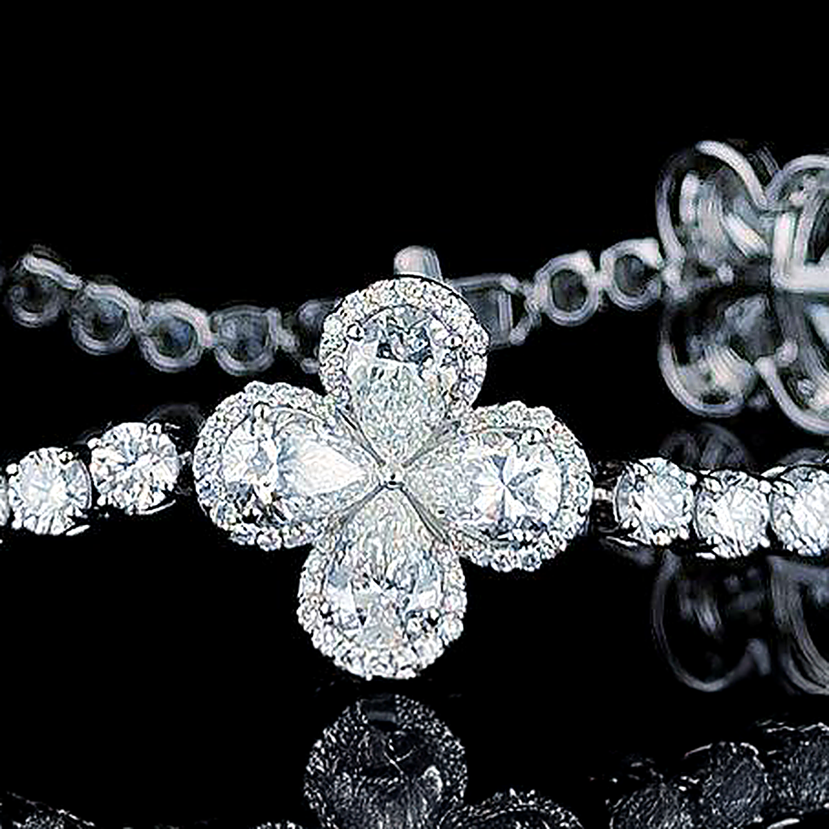 close macro of the pear clover motif on the 13ct lab grown diamond tennis bracelet