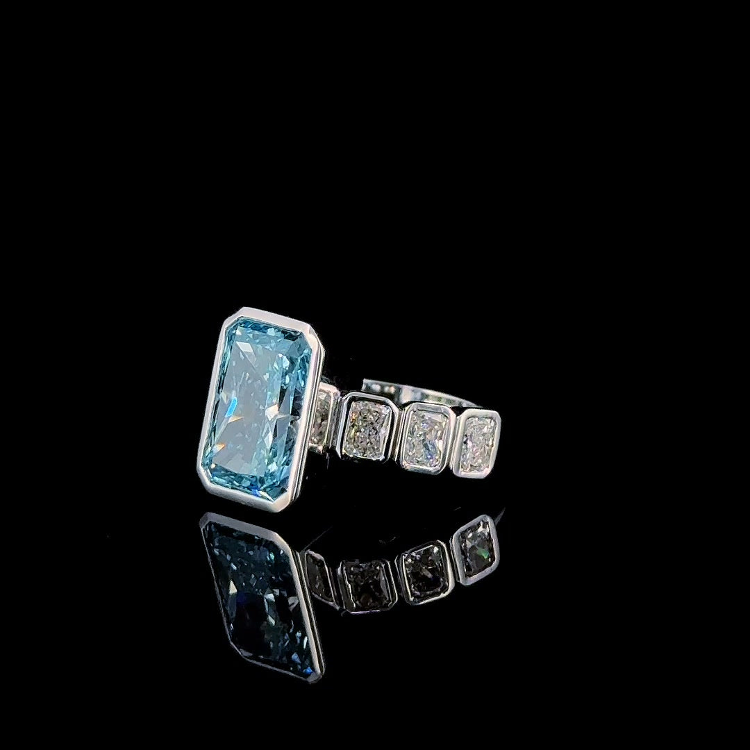 fancy blue radiant lab diamond ring three quarter view, bezel set sides