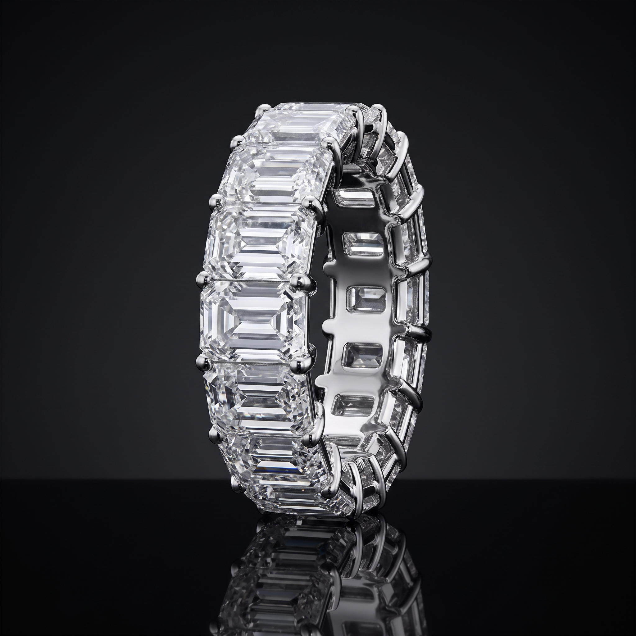 8ct emerald cut lab grown diamond eternity band, white gold, straight on view on black