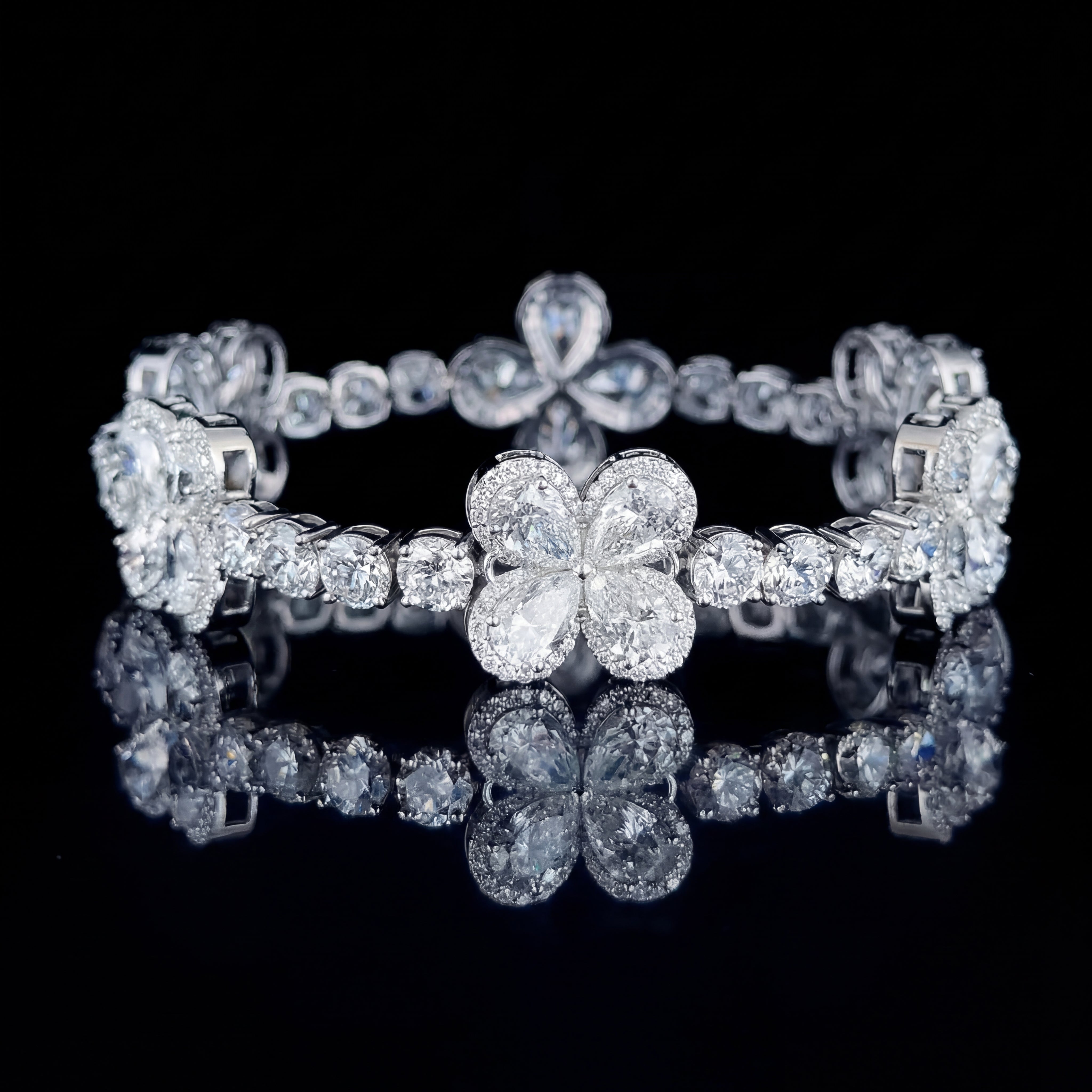 The Clover by Draco Diamond | 24.54ct pear and round brilliant flower cluster tennis bracelet | IGI certified 10K white gold