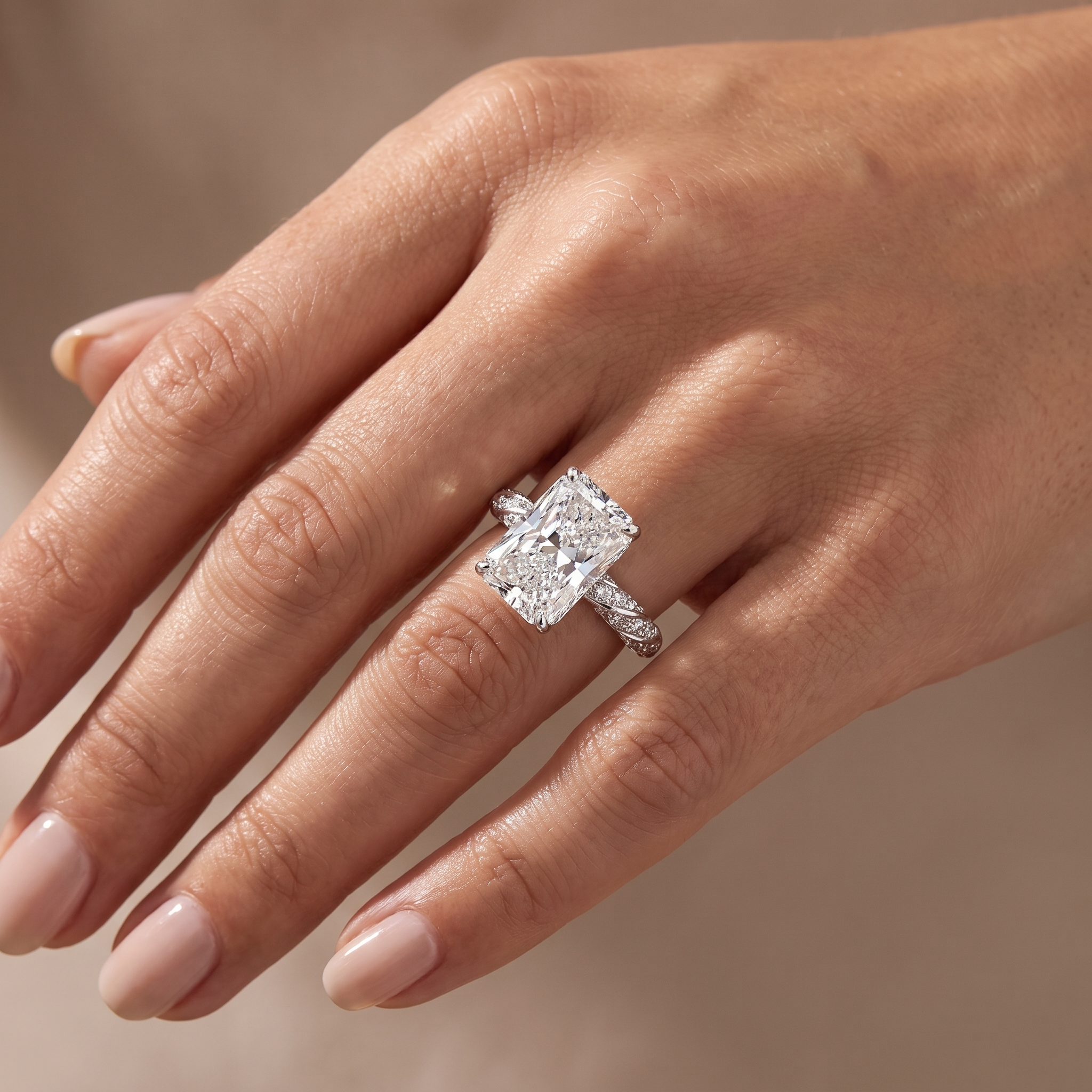 5ct radiant cut lab grown diamond engagement ring worn on a woman's hand, pave band