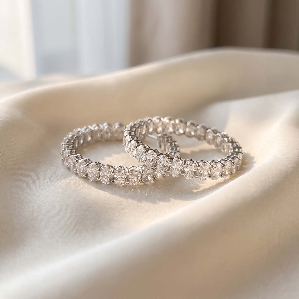 11ctw oval inside-out lab grown diamond hoop earrings styled on ivory silk