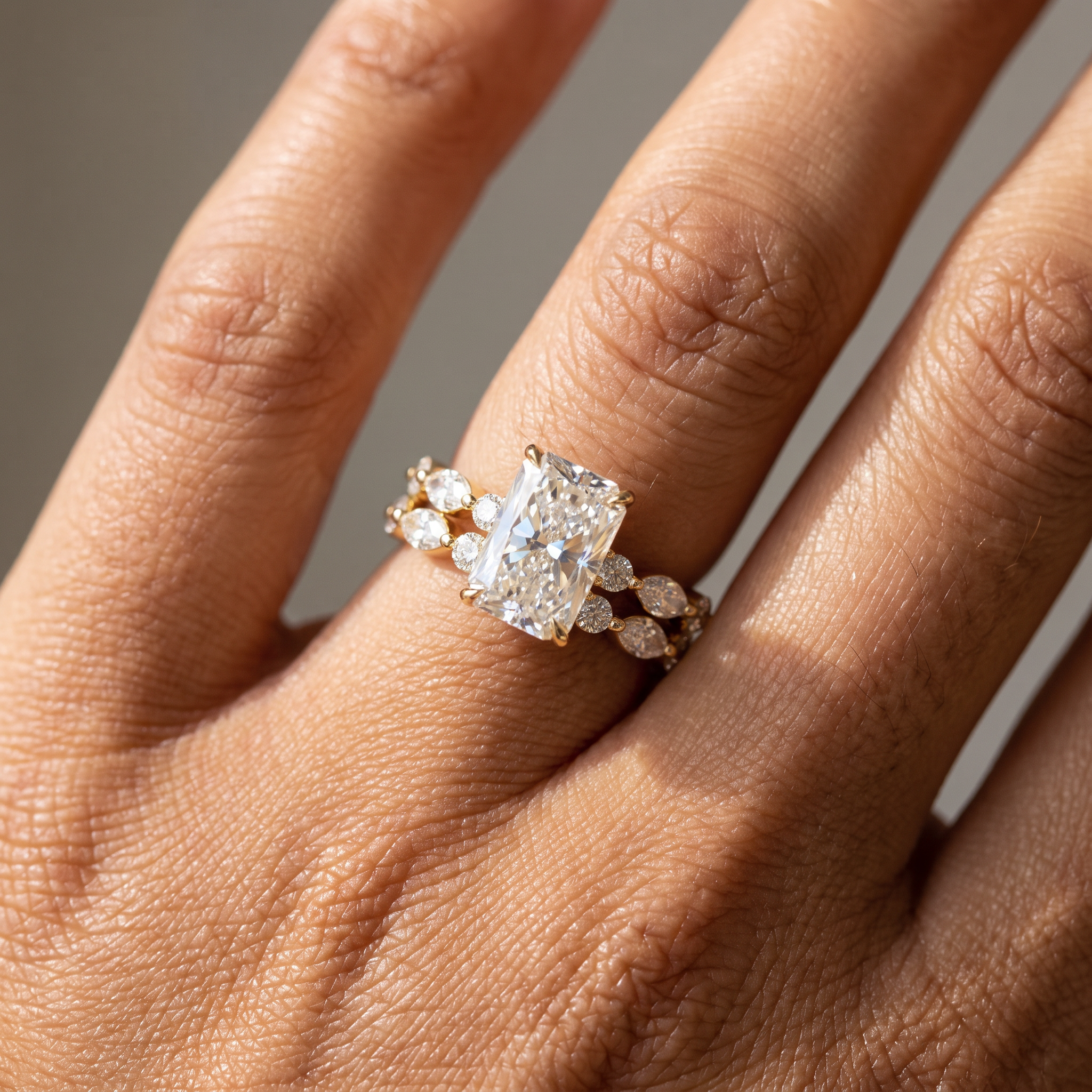 3ct elongated cushion lab grown diamond bridal set worn on the hand, ring and band stacked flush, close-up