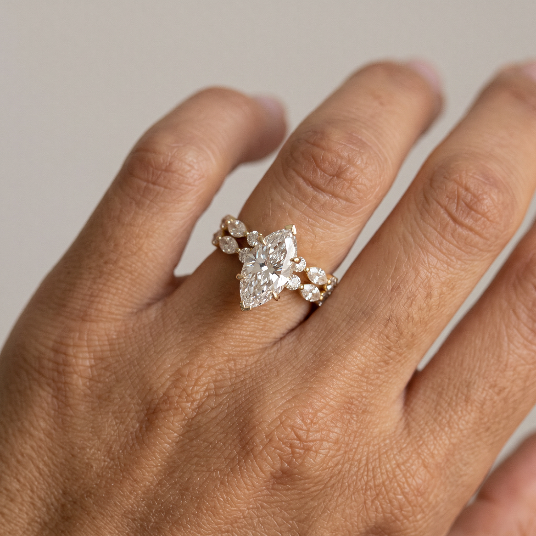 3ct marquise lab grown diamond bridal set worn on the hand, ring stacked with the matching band