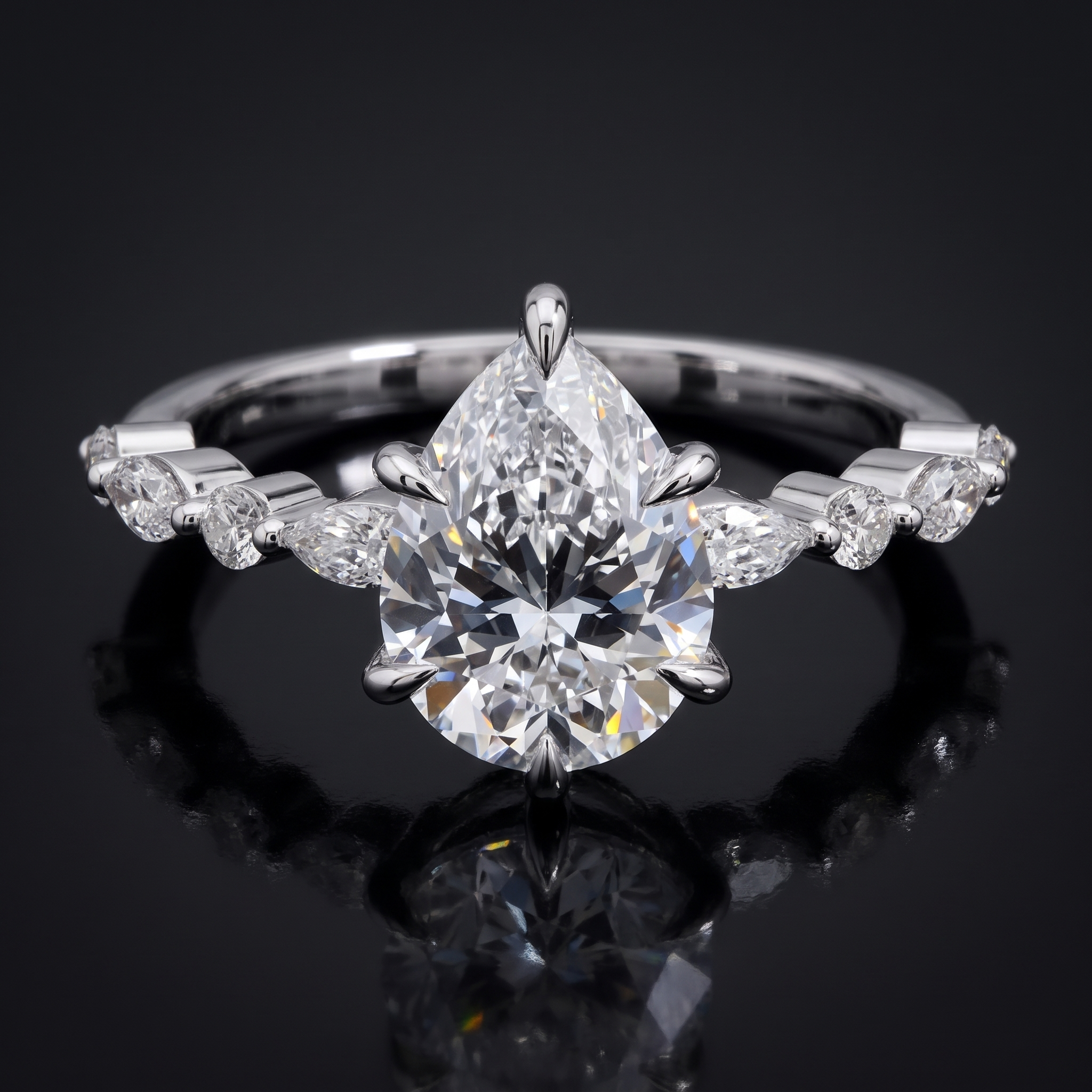 2.5ct pear lab grown diamond engagement ring with marquise and round band, on black