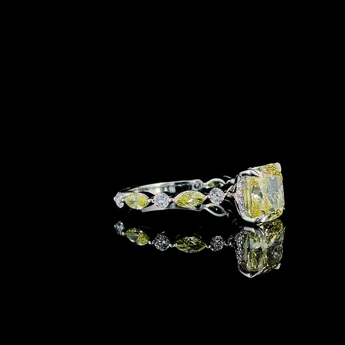 3ct fancy yellow cushion lab grown diamond ring on black, three-quarter view from the right
