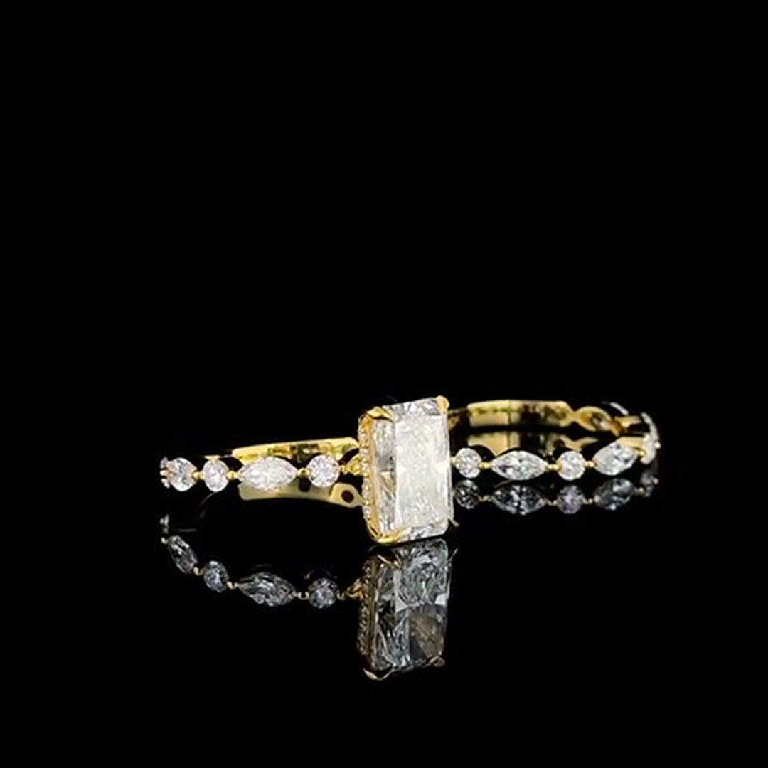 marquise and round diamond eternity band in yellow gold on black, side view