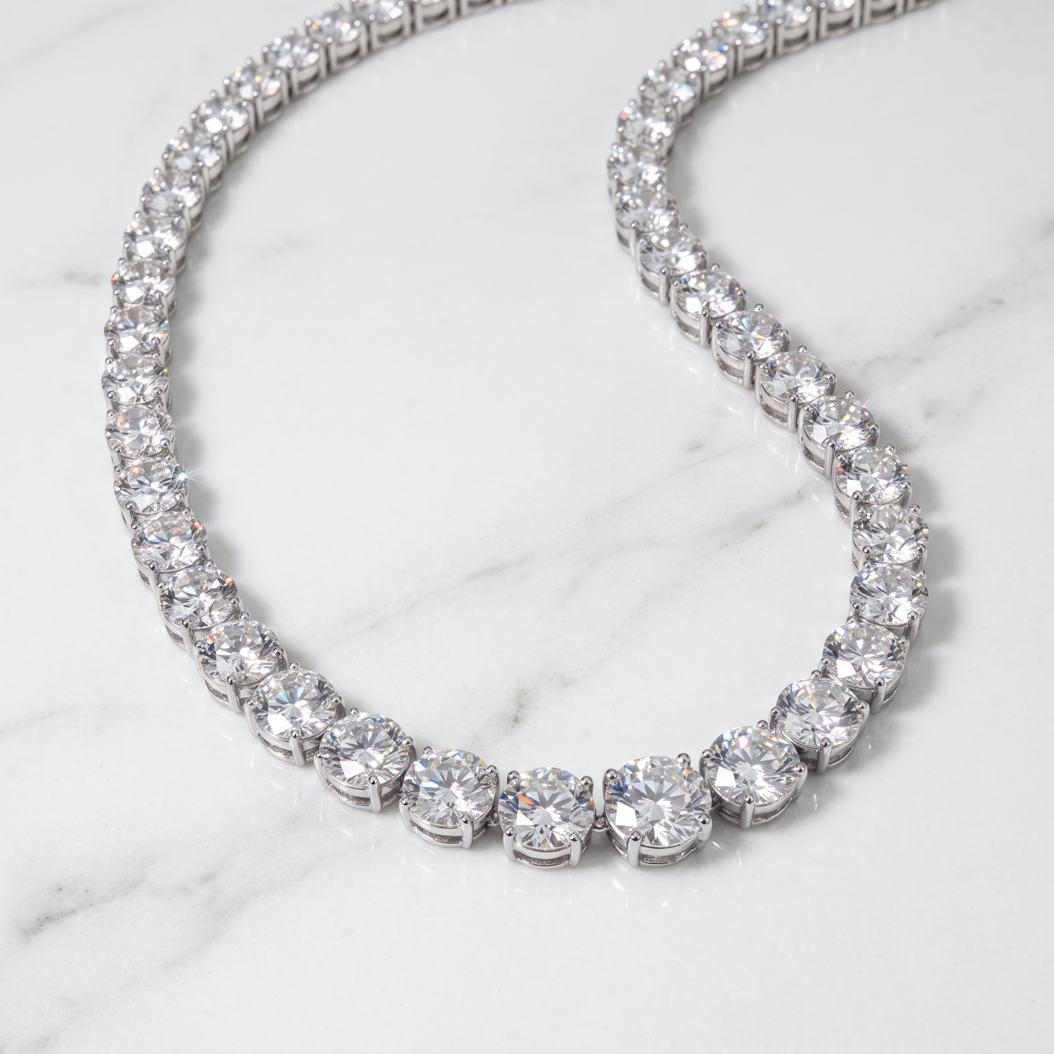 50ct graduated lab diamond tennis necklace draped on marble