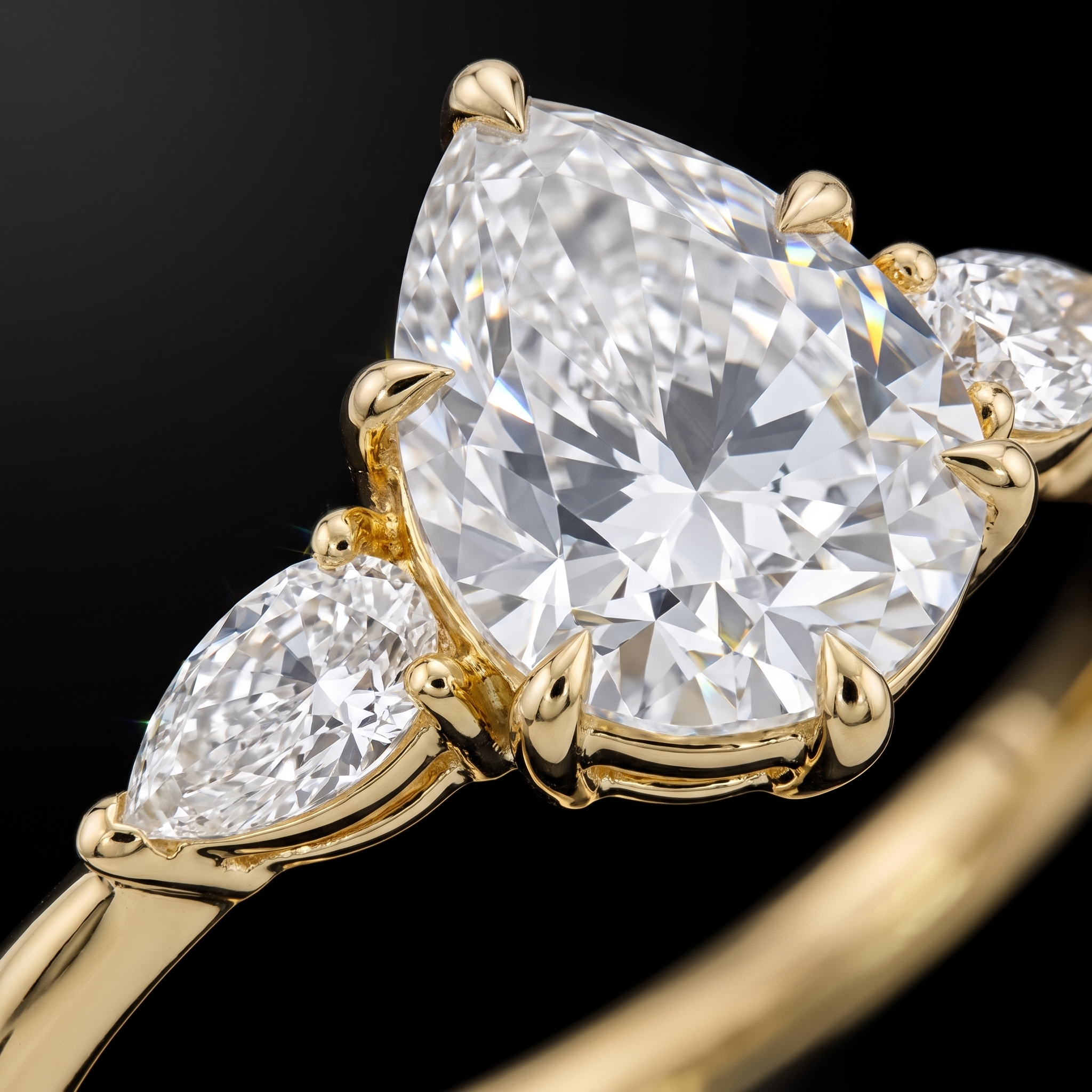 2ct pear cut lab diamond center with pear side stone, claw prong macro detail
