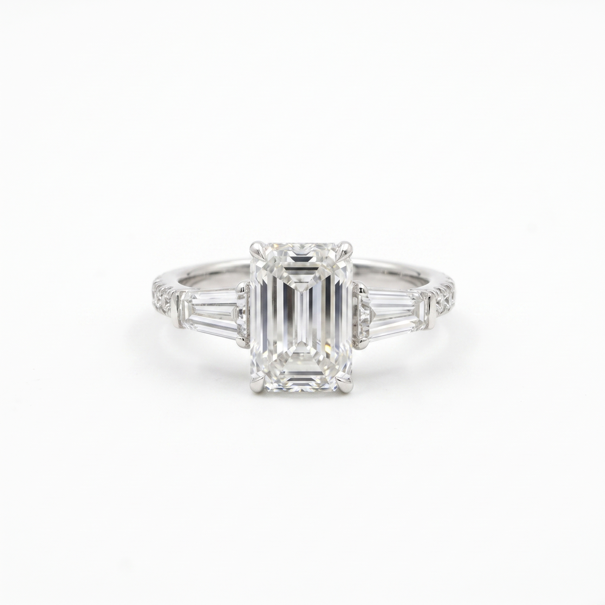 3ct emerald cut lab grown diamond ring with tapered baguettes, white background