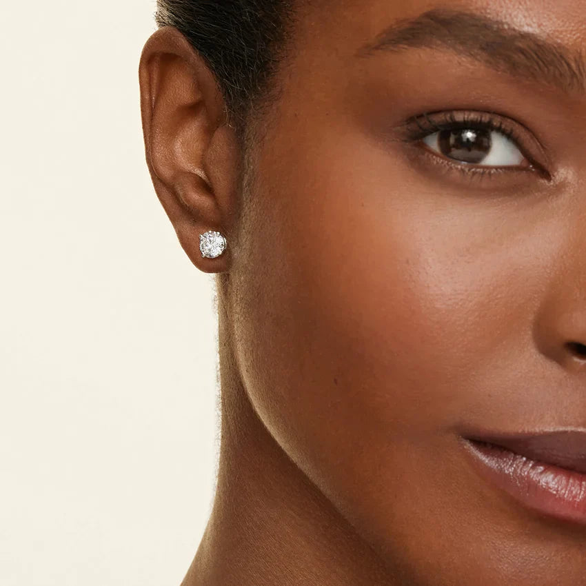 1ctw lab diamond stud earrings in white gold worn on model, a common first diamond purchase