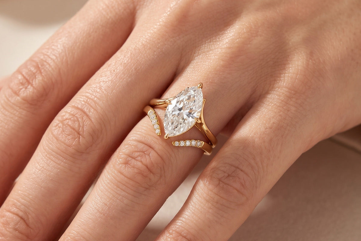 Marquise cut lab grown diamond ring in yellow gold worn on a hand in warm daylight, showing the elongated finger coverage a marquise gives, Draco Diamond