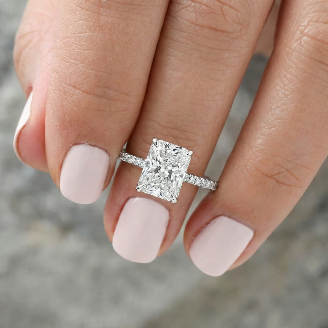 Radiant cut lab diamond solitaire engagement ring worn on the hand, IGI certified, Draco Diamond