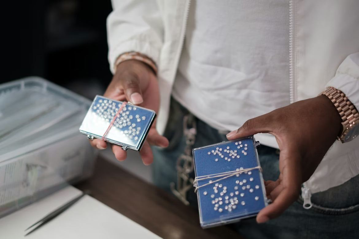 Loose lab grown diamond parcels held open in trade boxes for Canadian pricing analysis