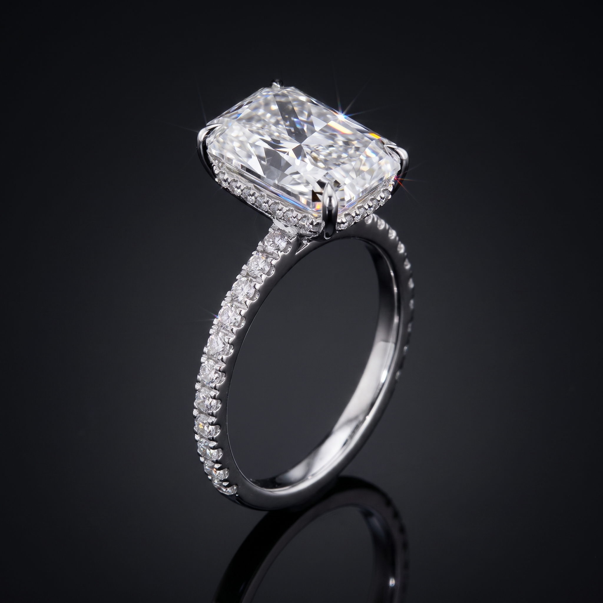 5ct radiant cut lab grown diamond engagement ring with hidden halo and pave band, white gold, on black