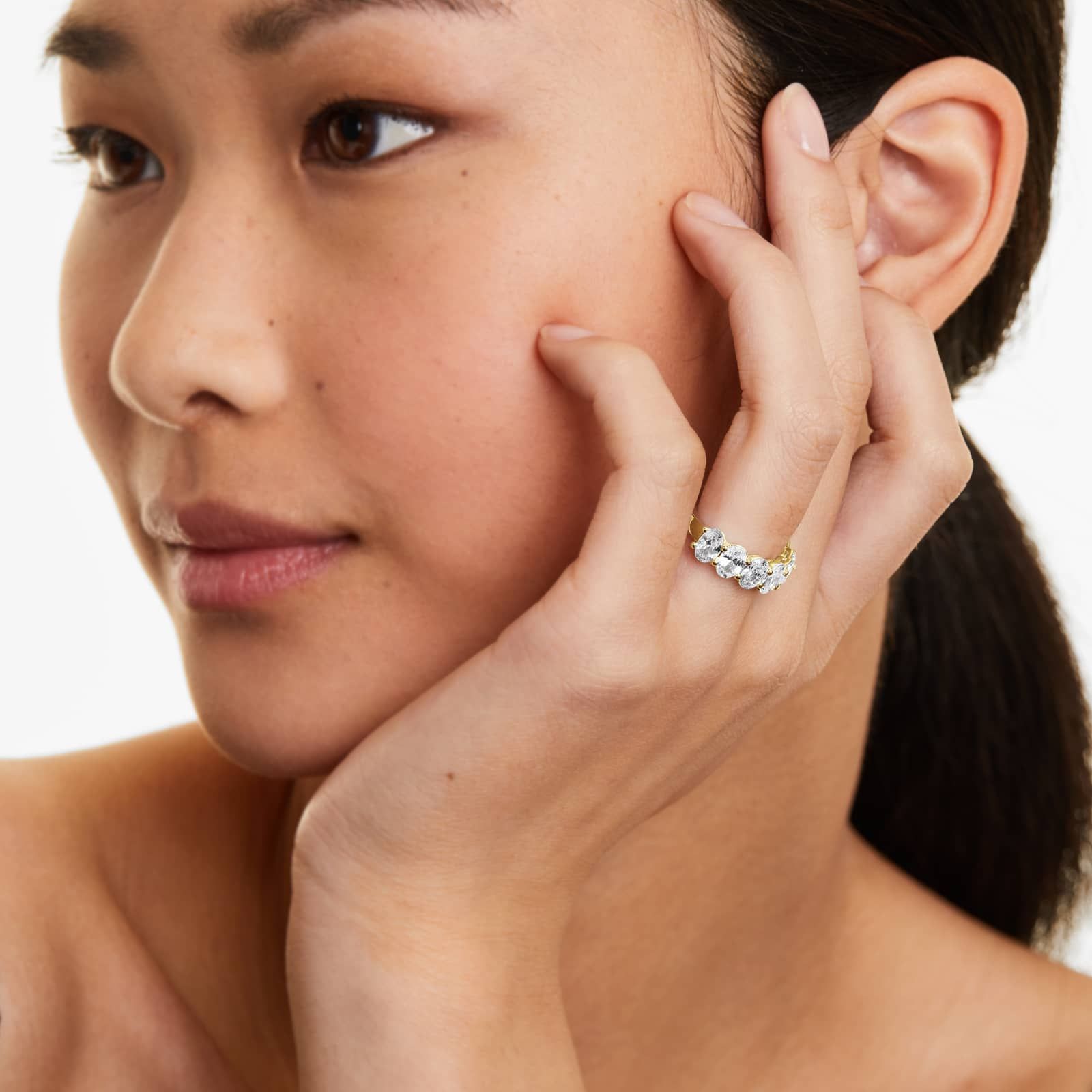 Women's 3.5ct Seven Stone Oval Cut Anniversary Ring on model, styled 10K gold ring