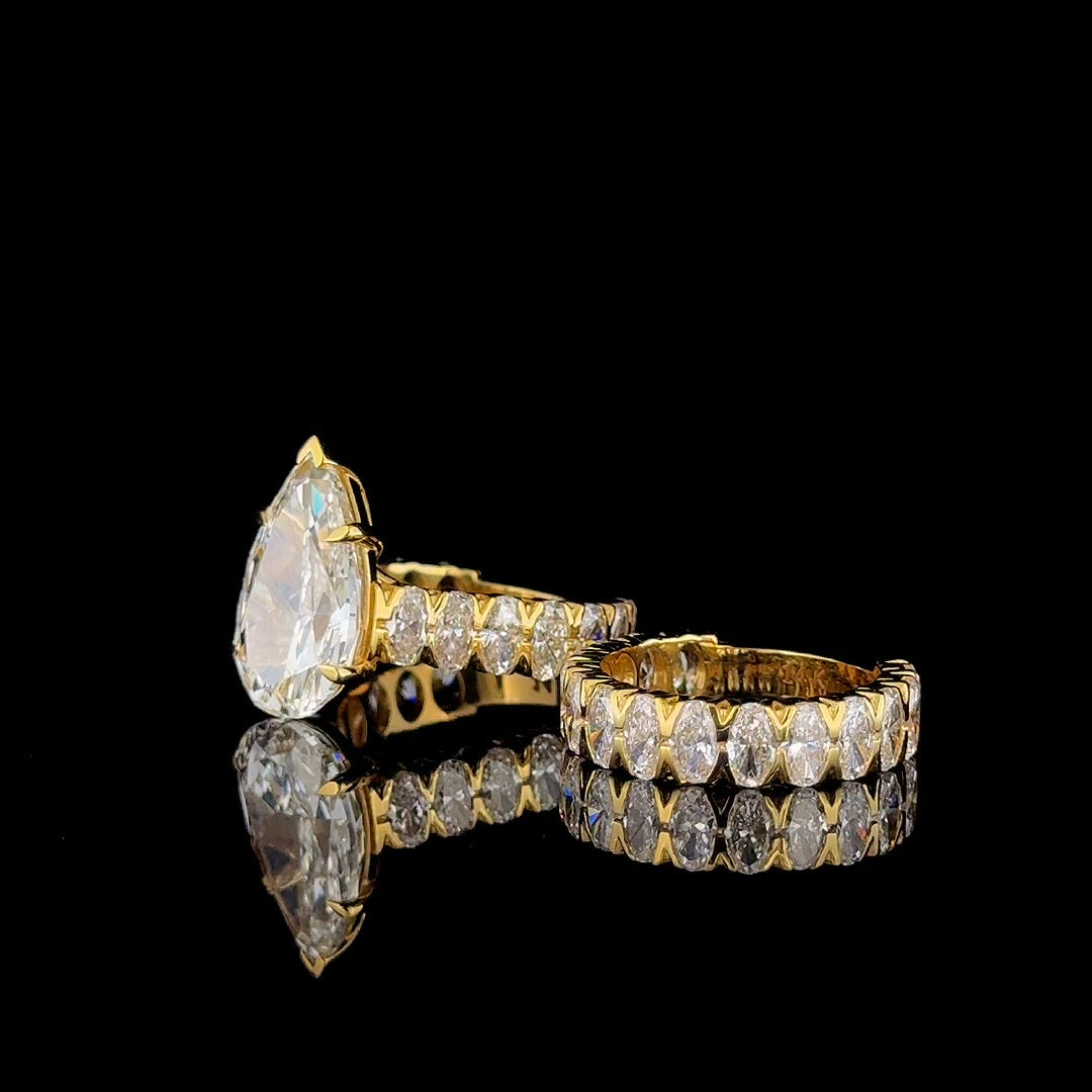 pear lab diamond bridal set, engagement ring and oval eternity band together