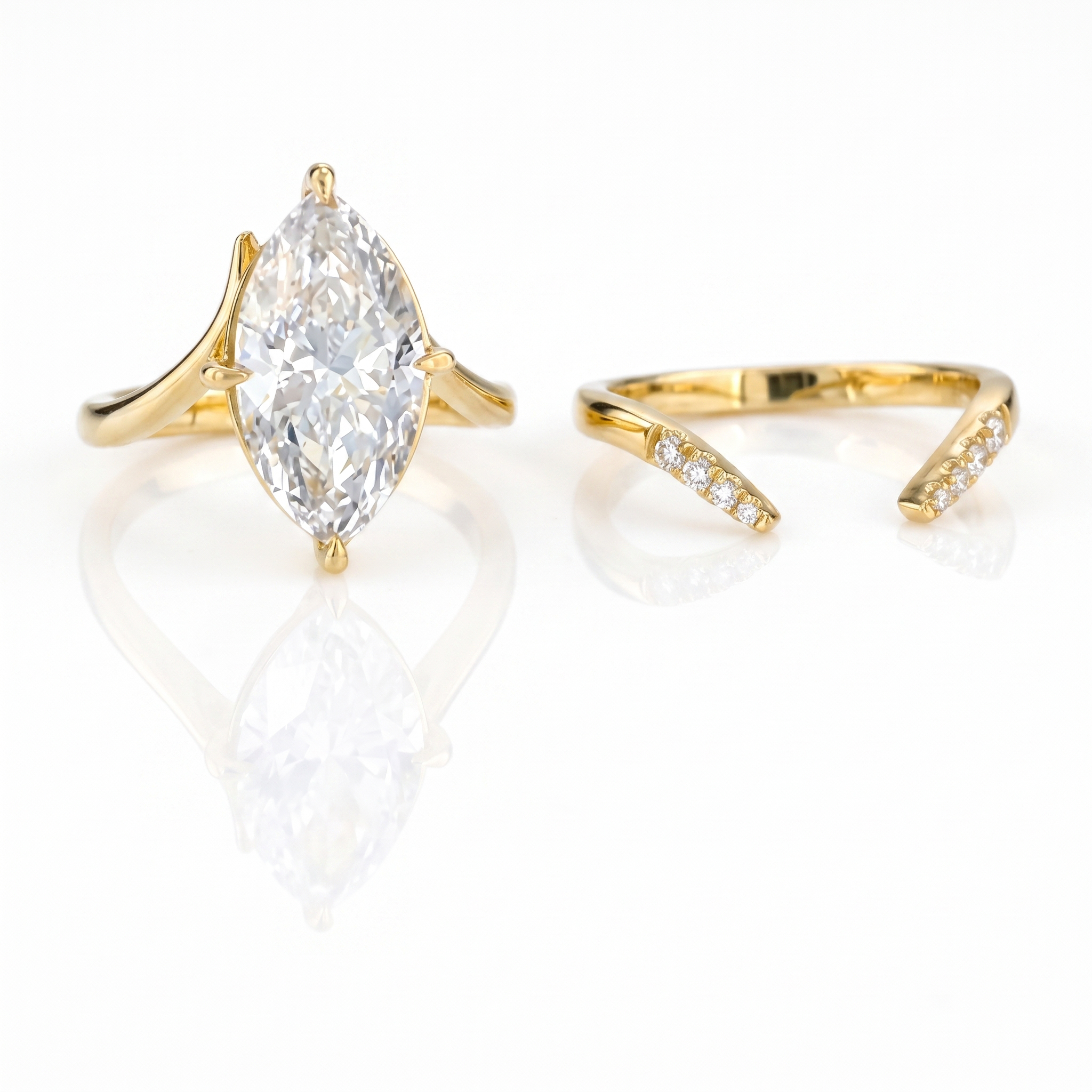 3ct marquise diamond bridal set on white background, plain split shank solitaire and pave chevron band