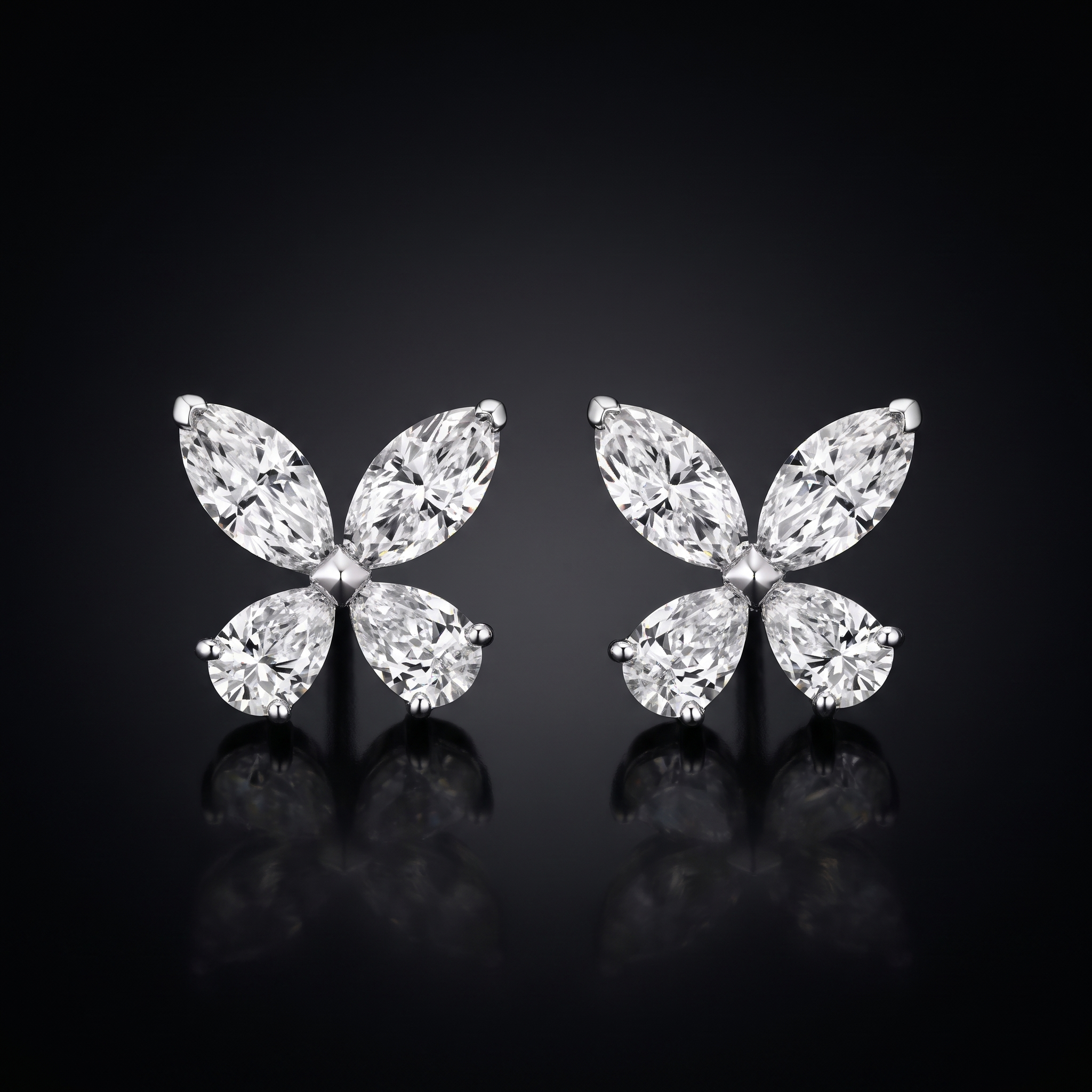 2ct butterfly stud lab grown diamond earrings, on a black background