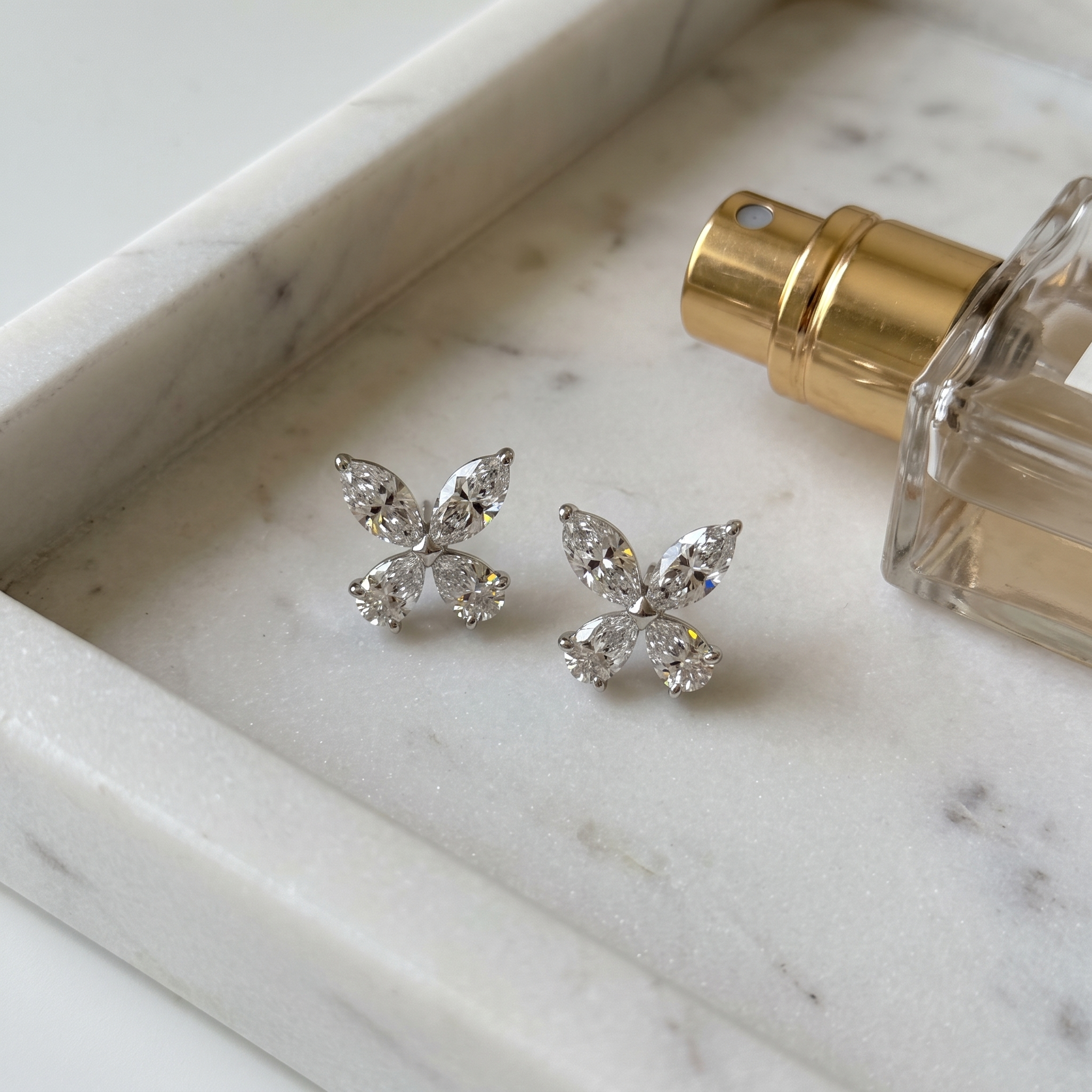 2ct butterfly stud lab grown diamond earrings, on a white background