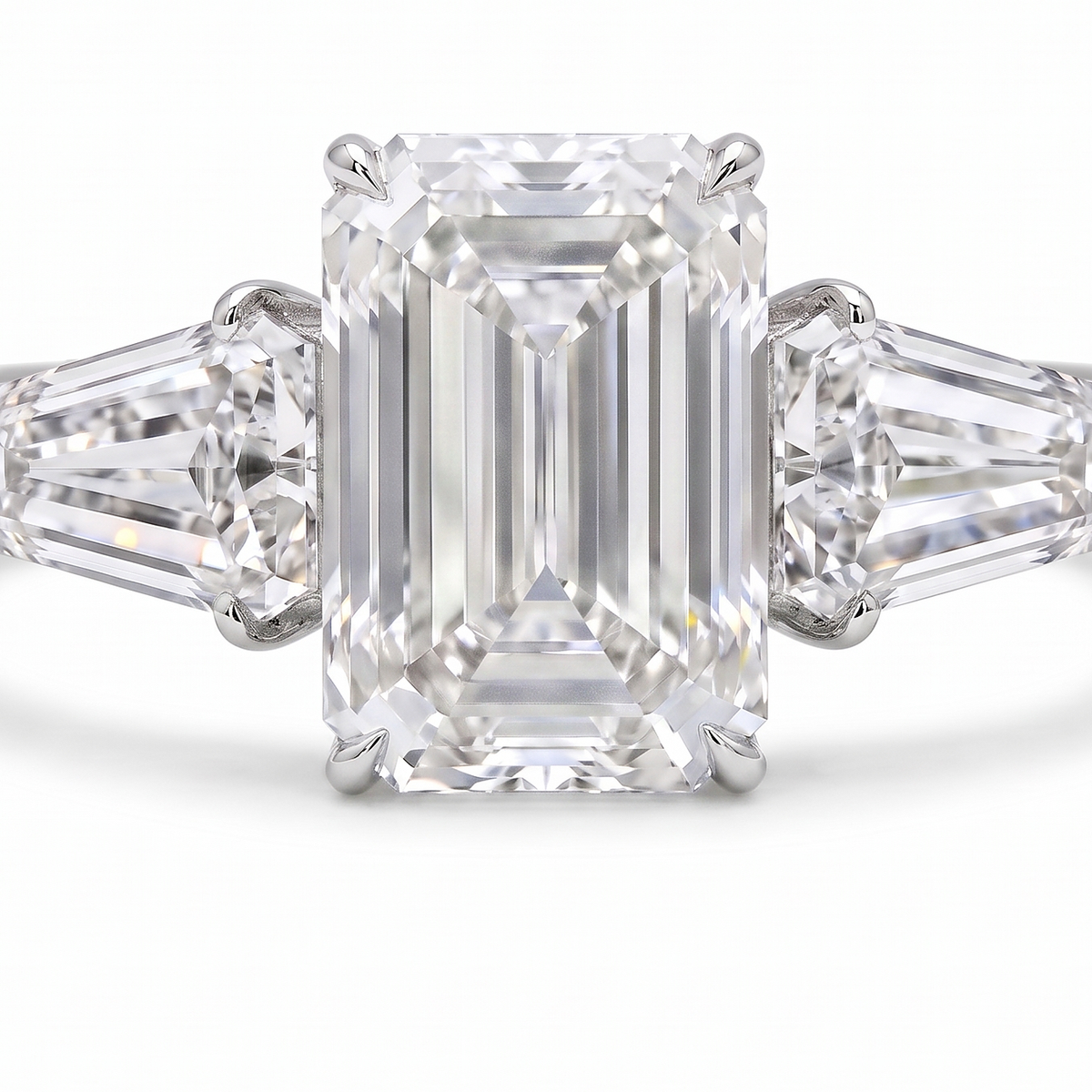 5ct emerald cut lab grown diamond ring detail, step facets and shield cut side stones