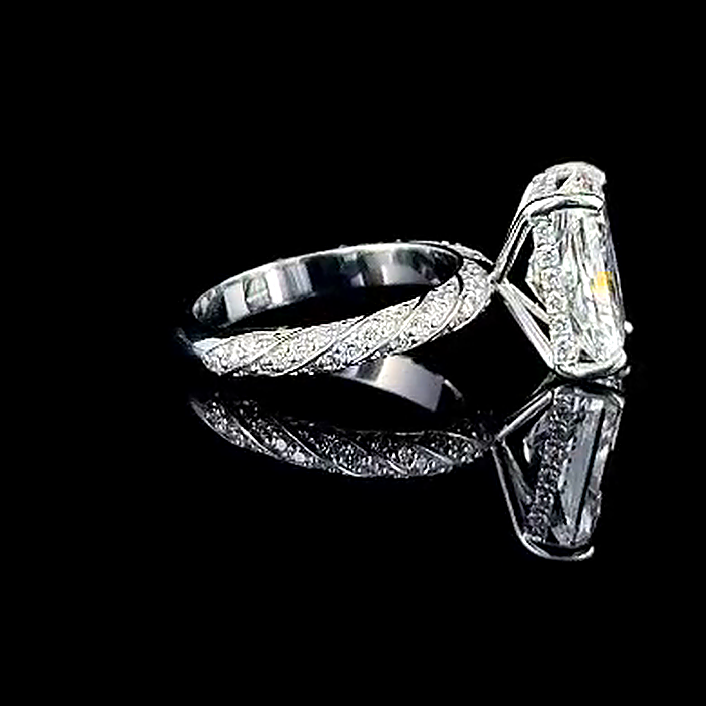 5ct radiant cut lab grown diamond engagement ring, real three quarter view of the elongated radiant and pave band