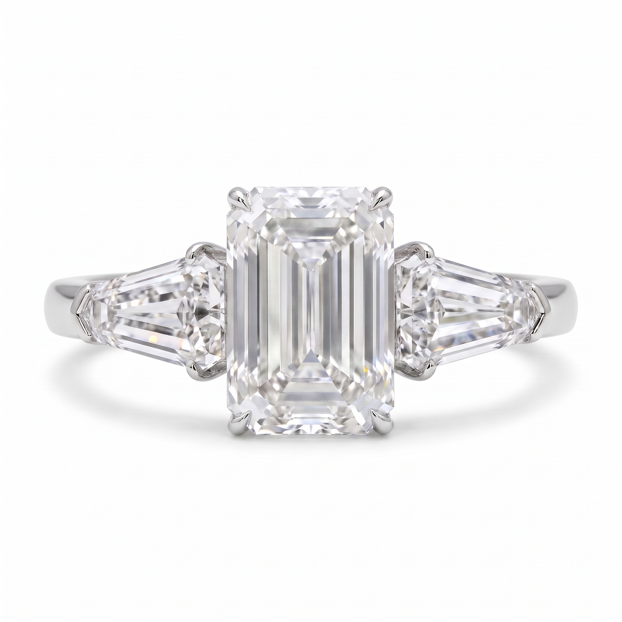 5ct emerald cut lab grown diamond ring with shield side stones, on a white background, front view