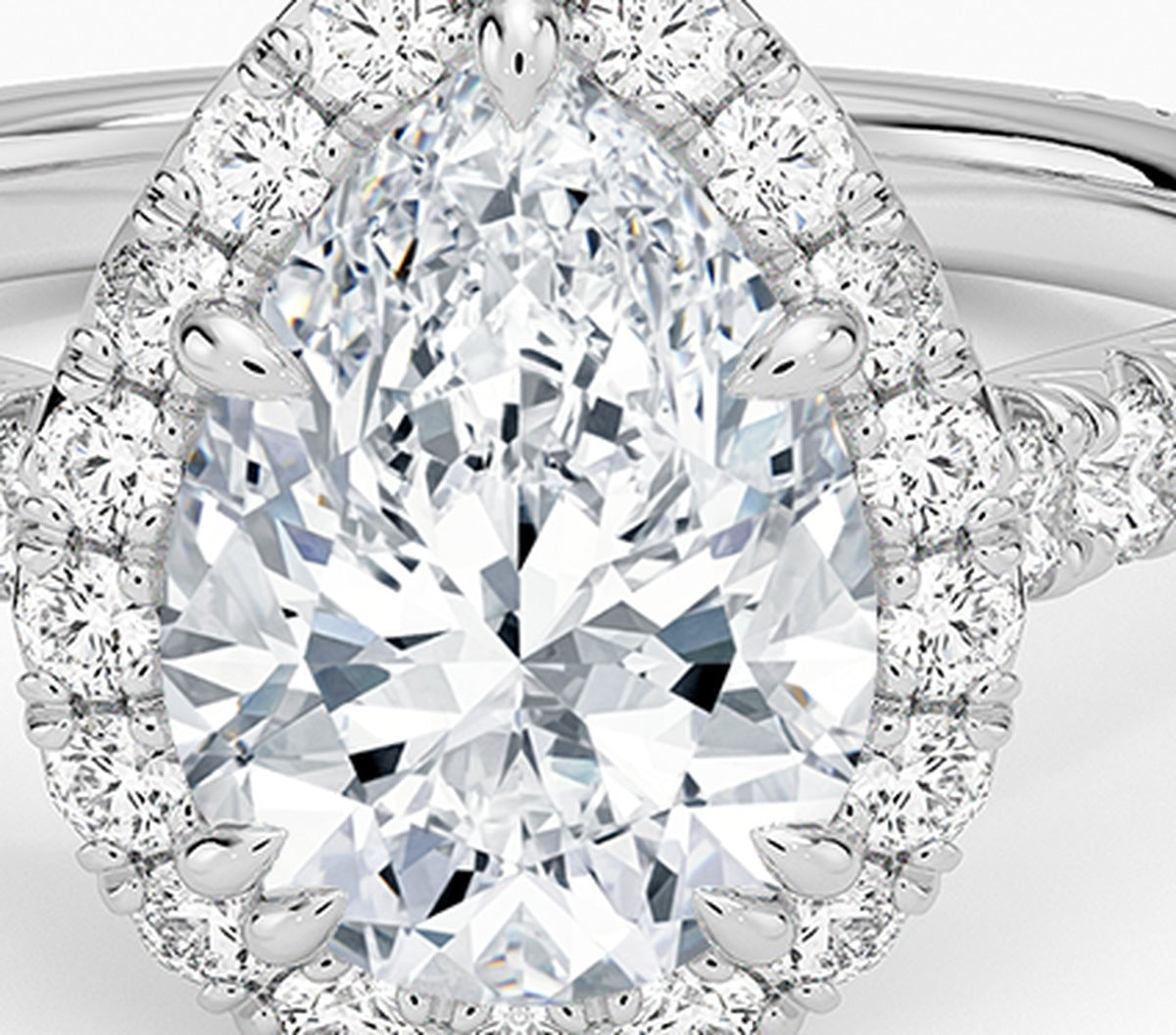 pear halo lab grown diamond ring detail, micro pave halo around pear center