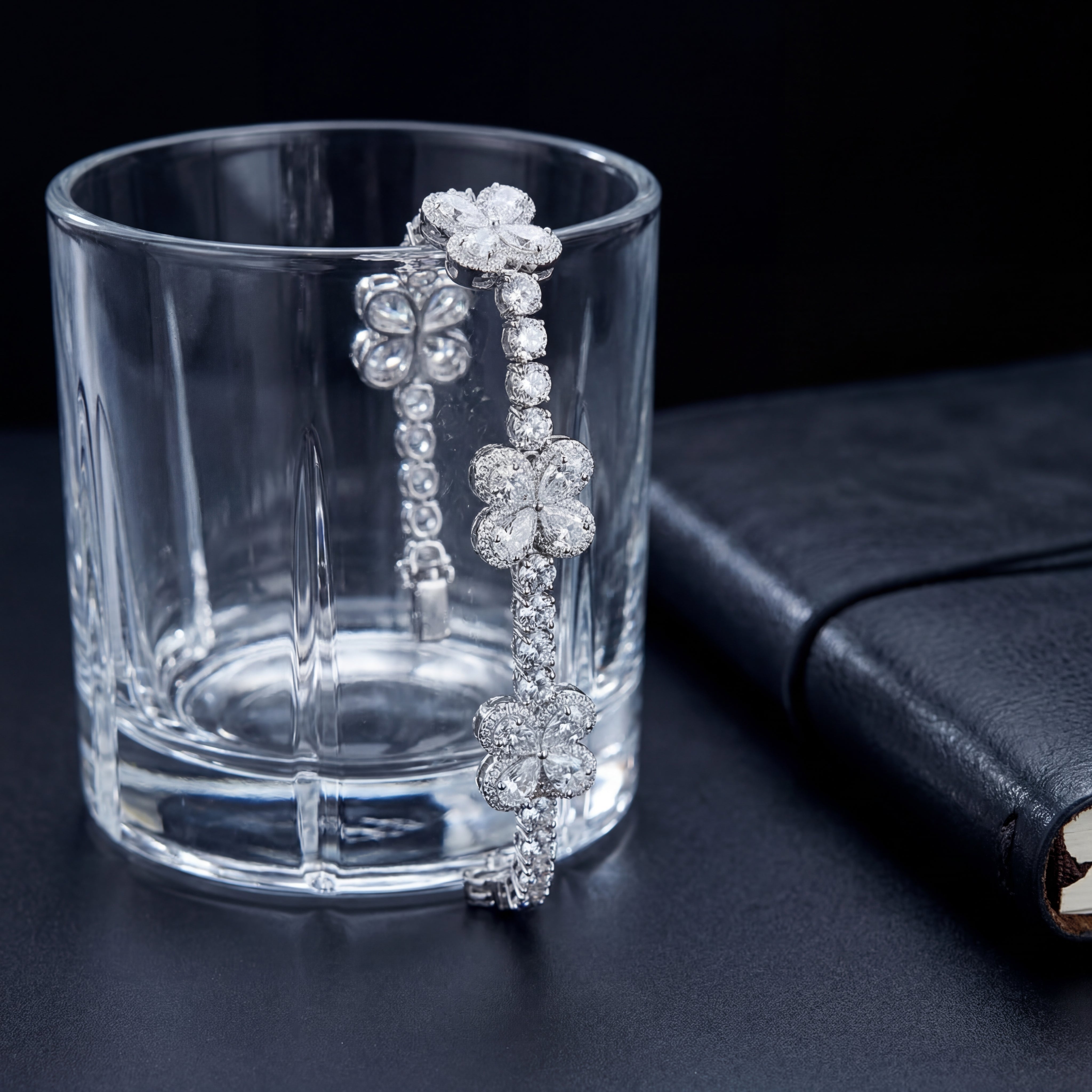 The Clover by Draco Diamond | 24.54ct lab diamond flower cluster tennis bracelet displayed on glass | 10K white gold