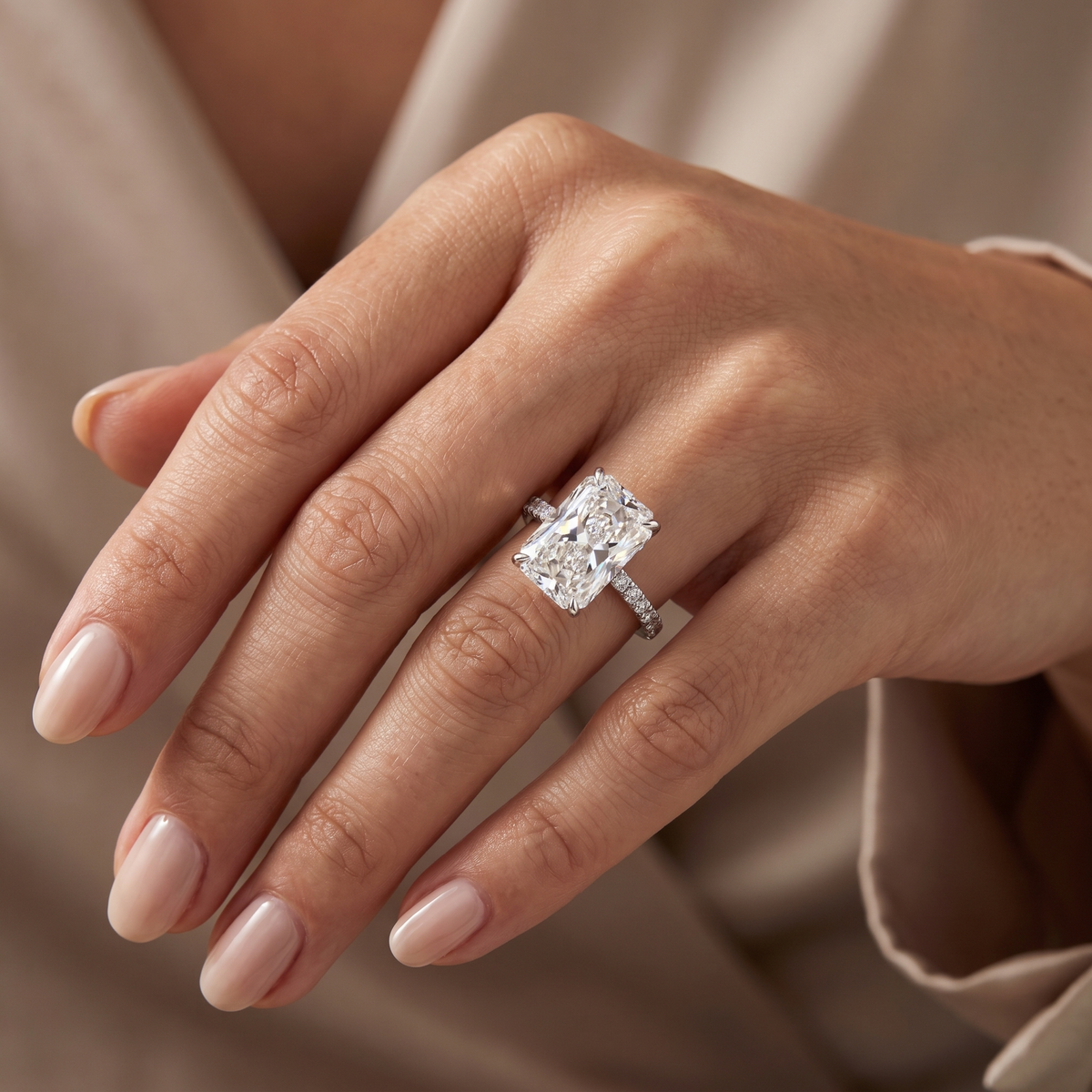 5ct radiant hidden halo lab grown diamond engagement ring worn on a woman's hand