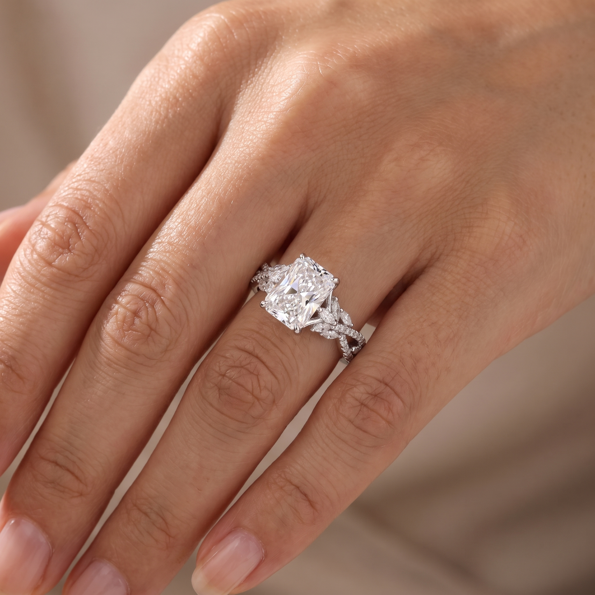 3ct radiant twisted vine lab grown diamond engagement ring worn on a womans hand