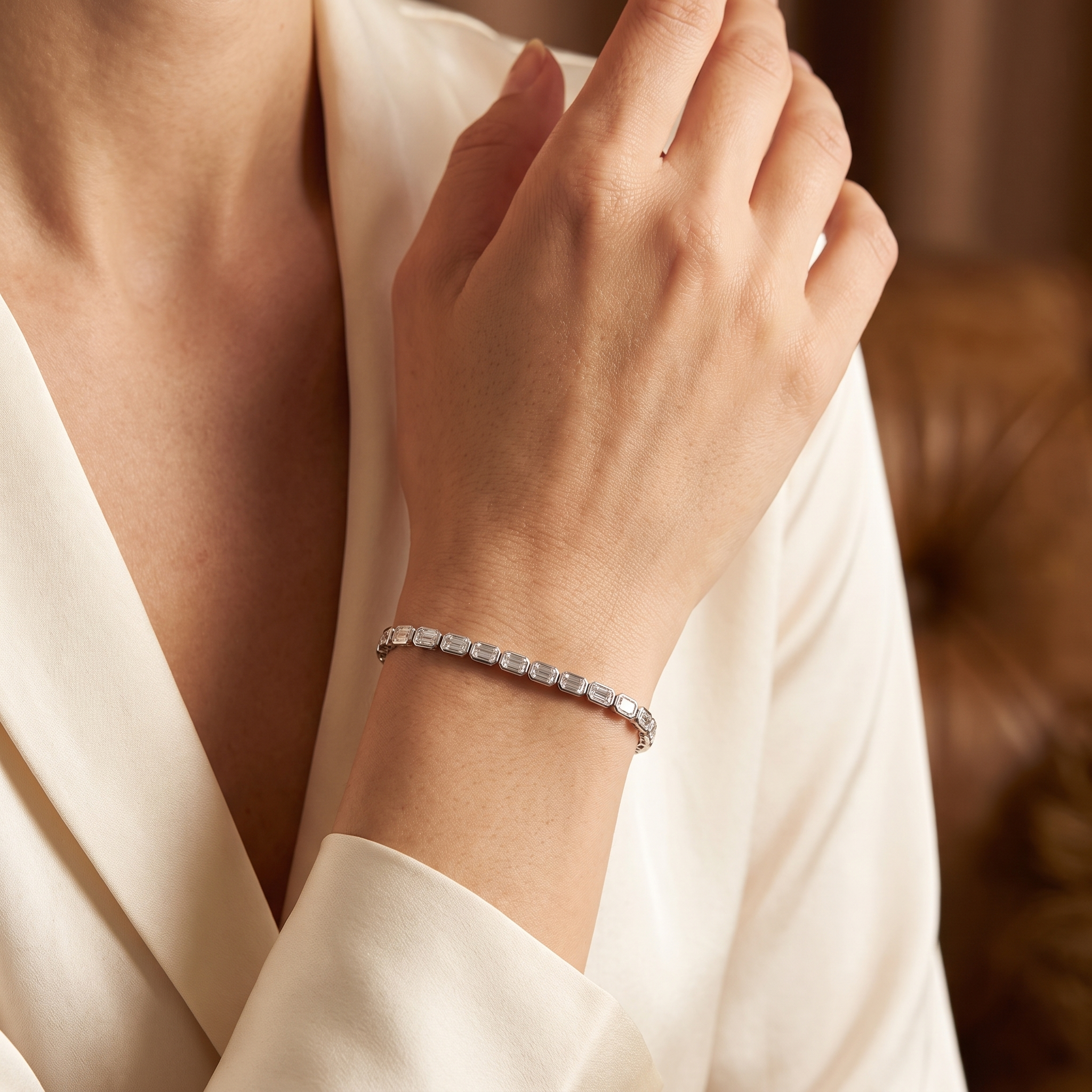 9ct emerald cut lab grown diamond tennis bracelet worn on wrist, lifestyle editorial