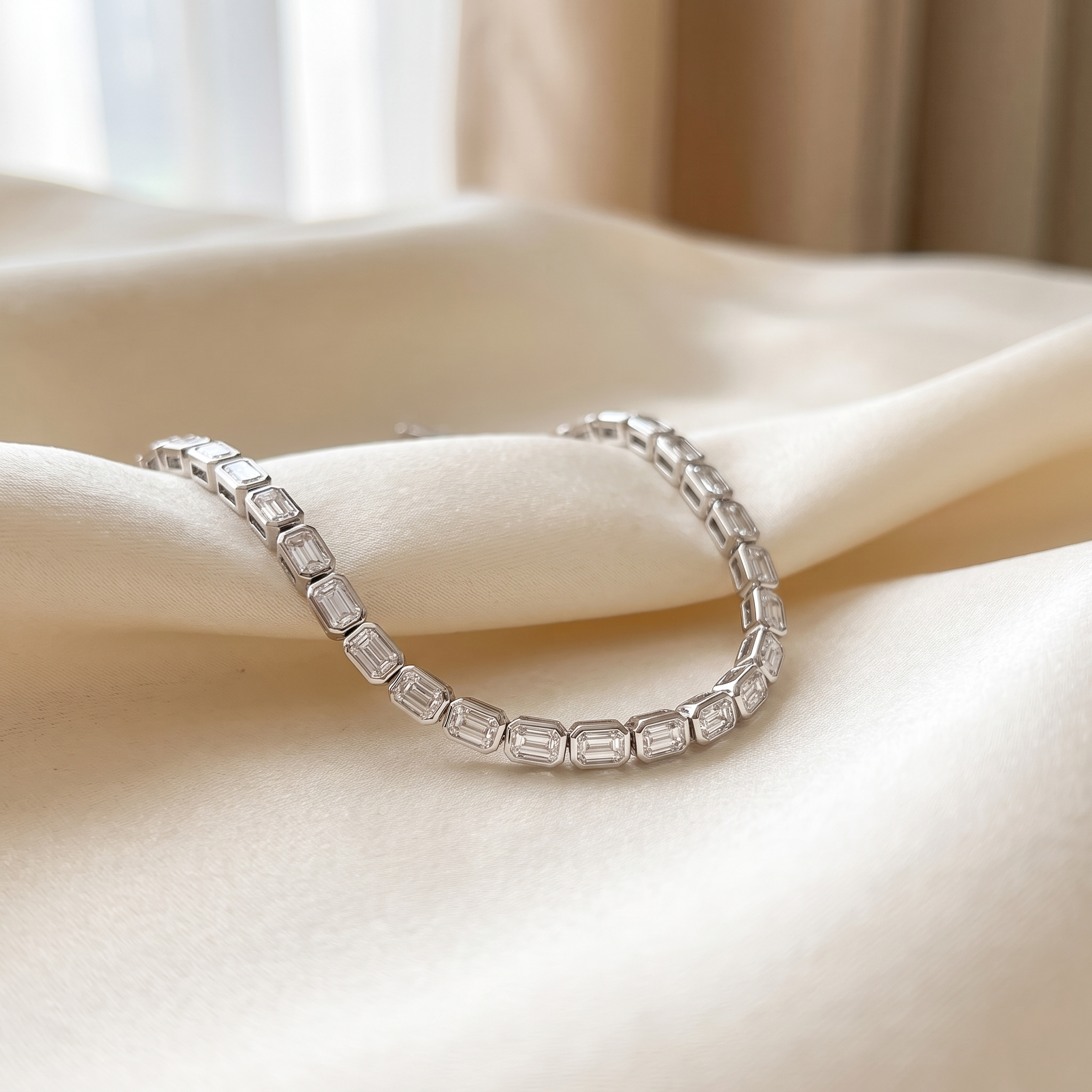 9ct emerald cut lab grown diamond tennis bracelet styled on ivory silk