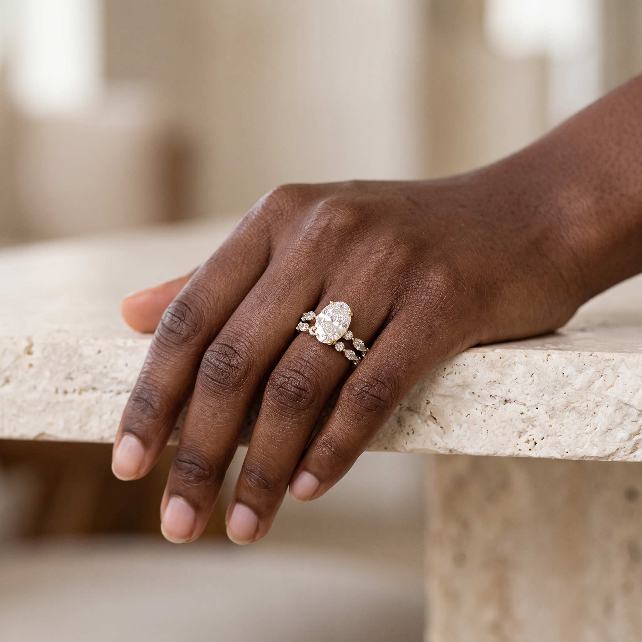 3ct oval yellow gold lab grown diamond bridal set worn on the hand, ring and band stacked, lifestyle view