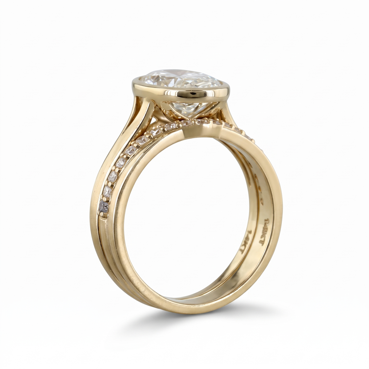 3ct oval bezel lab grown diamond bridal set, 14k yellow gold, split shank pave and matching band, studio profile on white