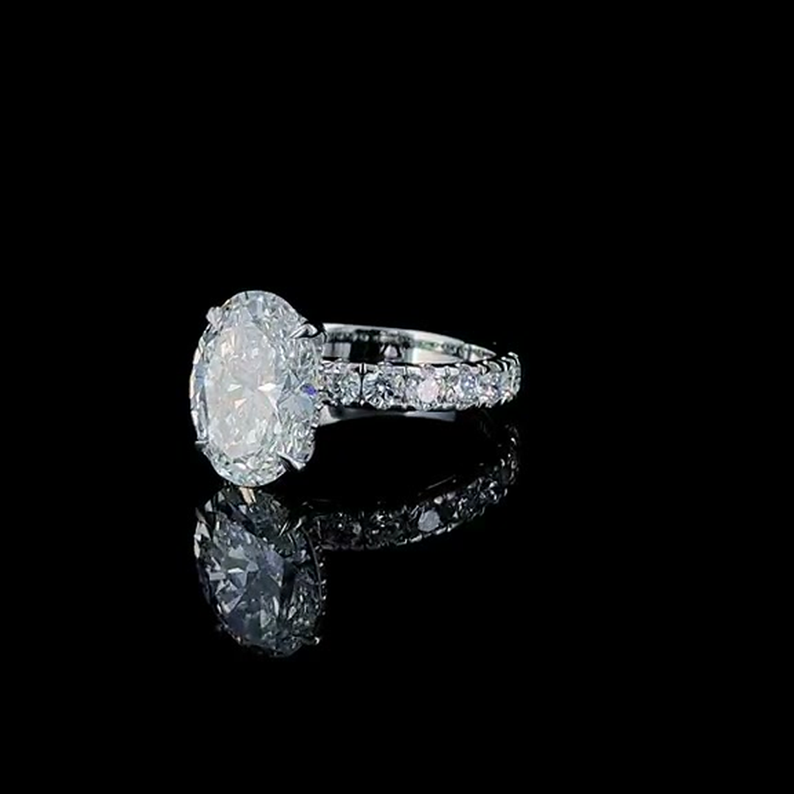 4ct oval cut lab grown diamond engagement ring on black, three-quarter view