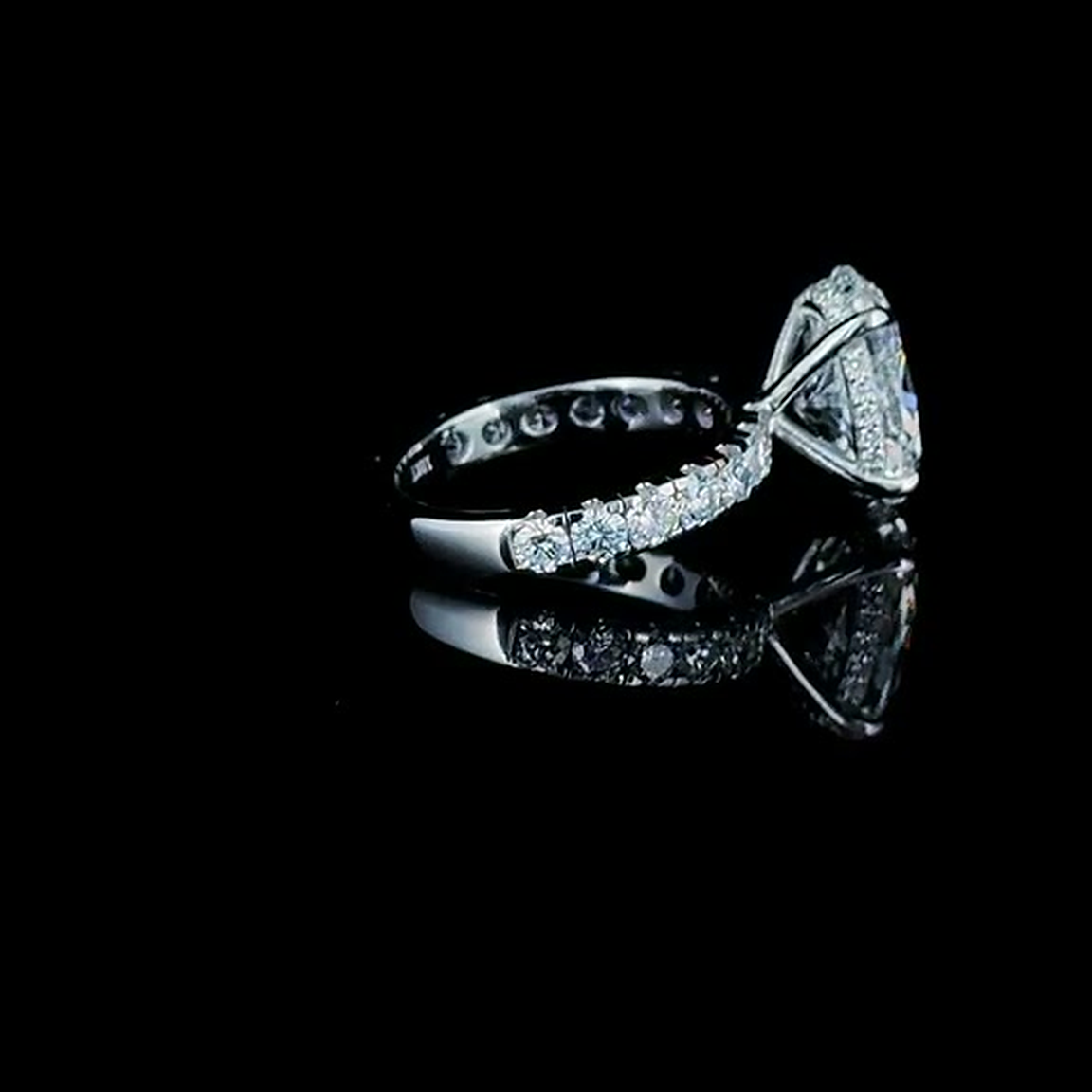 4ct oval cut lab grown diamond engagement ring on black, side profile showing the pave shoulders