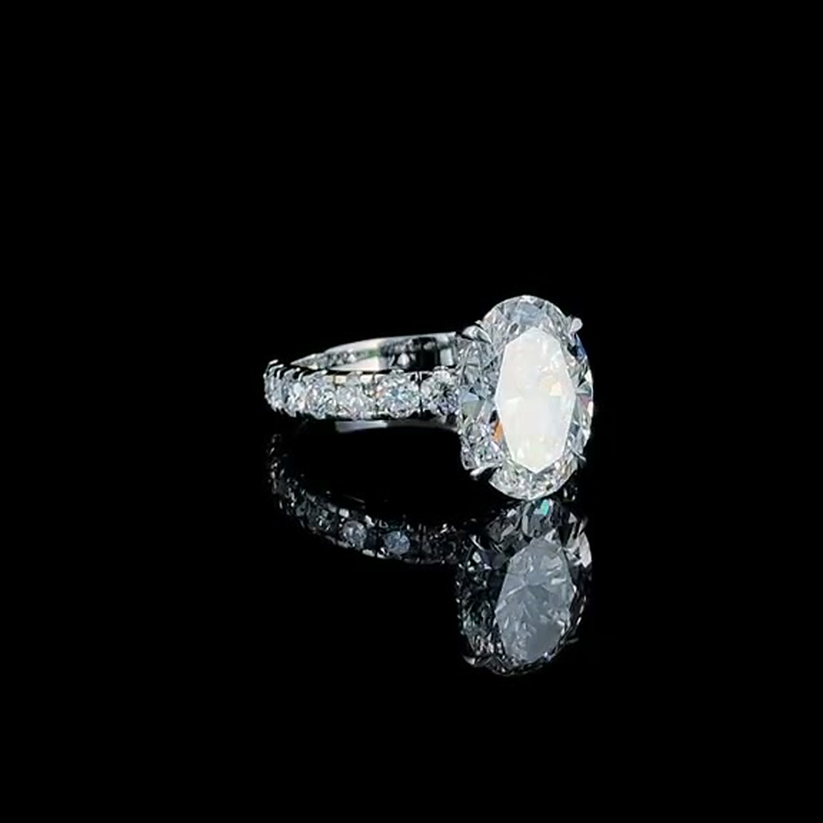 4ct oval cut lab grown diamond engagement ring on black, front view