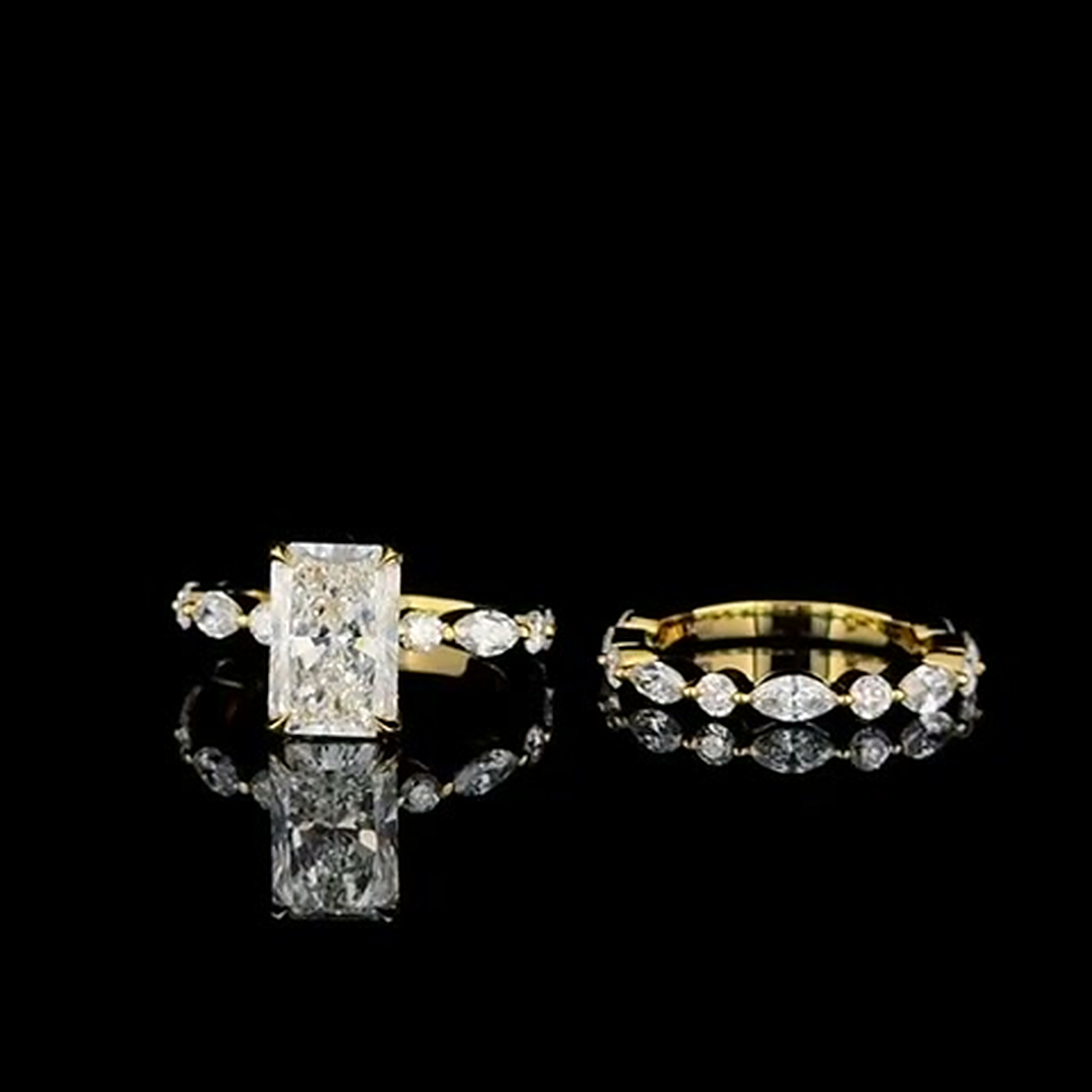 3ct elongated cushion lab grown diamond engagement ring and eternity band on black, front view