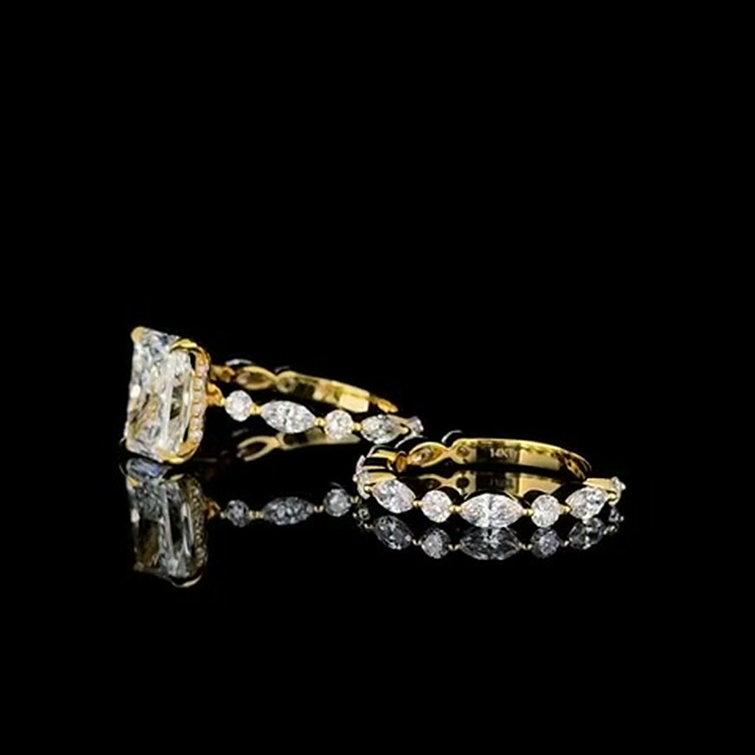 3ct elongated cushion lab grown diamond bridal set on black, three-quarter view with marquise and round accents