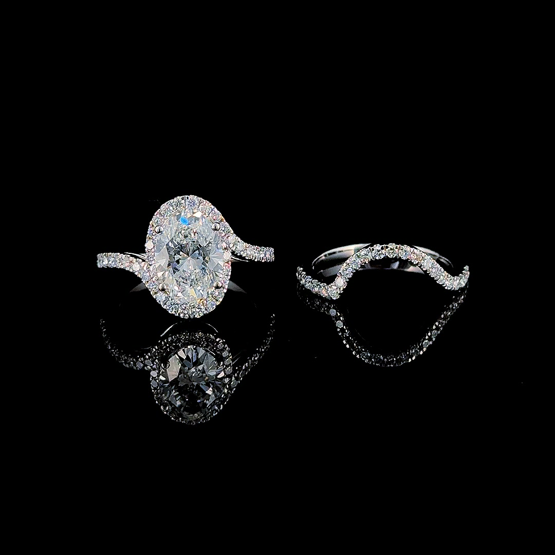 3ct oval halo lab grown diamond bridal set in white gold on black, engagement ring and contoured band