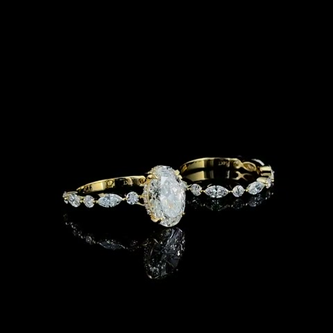 marquise and round diamond eternity band in yellow gold on black, side view