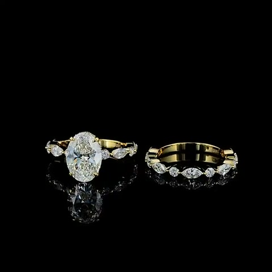3ct oval lab grown diamond bridal set in yellow gold on black, front view